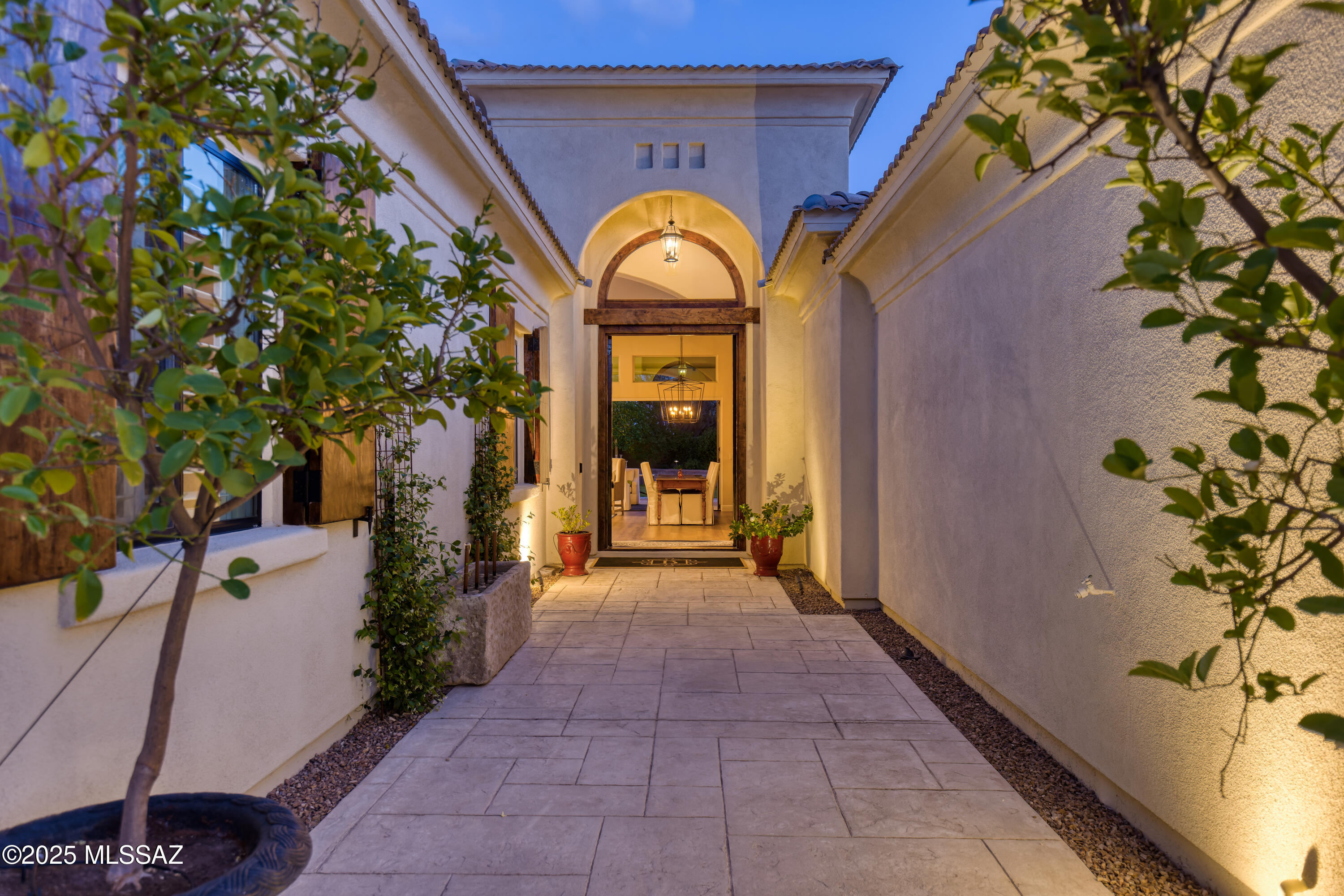 Exceptional  home on a Premium lot in gated Rivergate Estates. Experience the best of Foothills living in this beautifully updated home, perfectly situated on a premium lot with breathtaking city and mountain views. the expansive backyard is designed for entertainment, featuring lush grass, a sparkling pool, a sport court, and multiple gathering areas. This thoughtfully designed residence offers 4+ bedrooms, a spacious office, and a detached structure with a basement-ideal as a media room, gym or entertainment space. Completely renovated in 2024, the home boasts brand-new HVAC systems, H20 heater, pool equipment, bomanite and plaster, new roof, appliances. Aesthetic upgrades include modern flooring, quartz countertops, wine room, and an impressive window system.