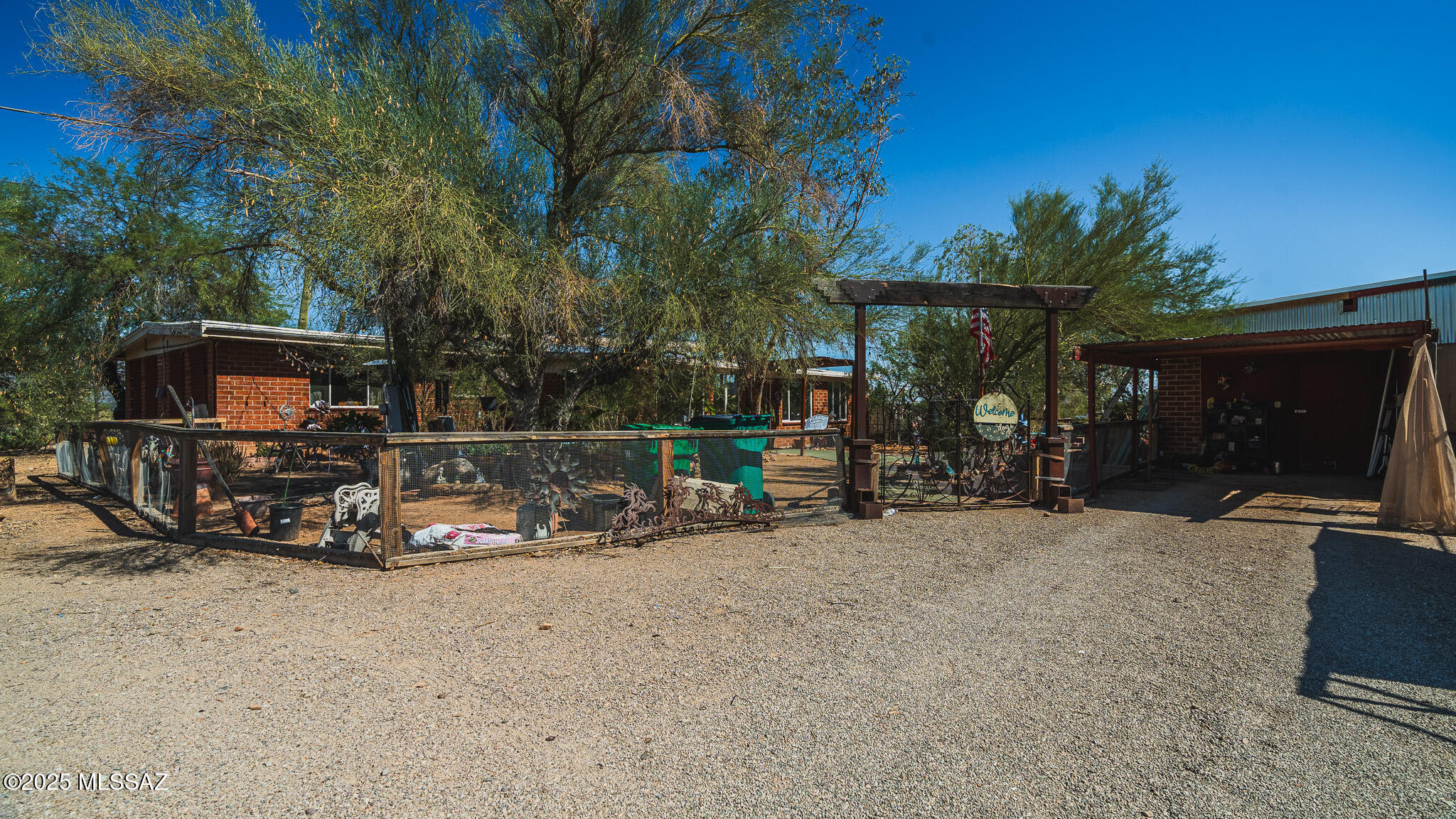 Stunning desert retreat on 4.38 acres!
Embrace privacy in this 3 bedroom, 2 bath ranch style home. Built in 1953, this home features original exposed beams, classic wood and brick finishes and a cozy fireplace. Outside, you have amazing mountain views and plenty of room for horses, RV's, boats.. all the toys you can think of!