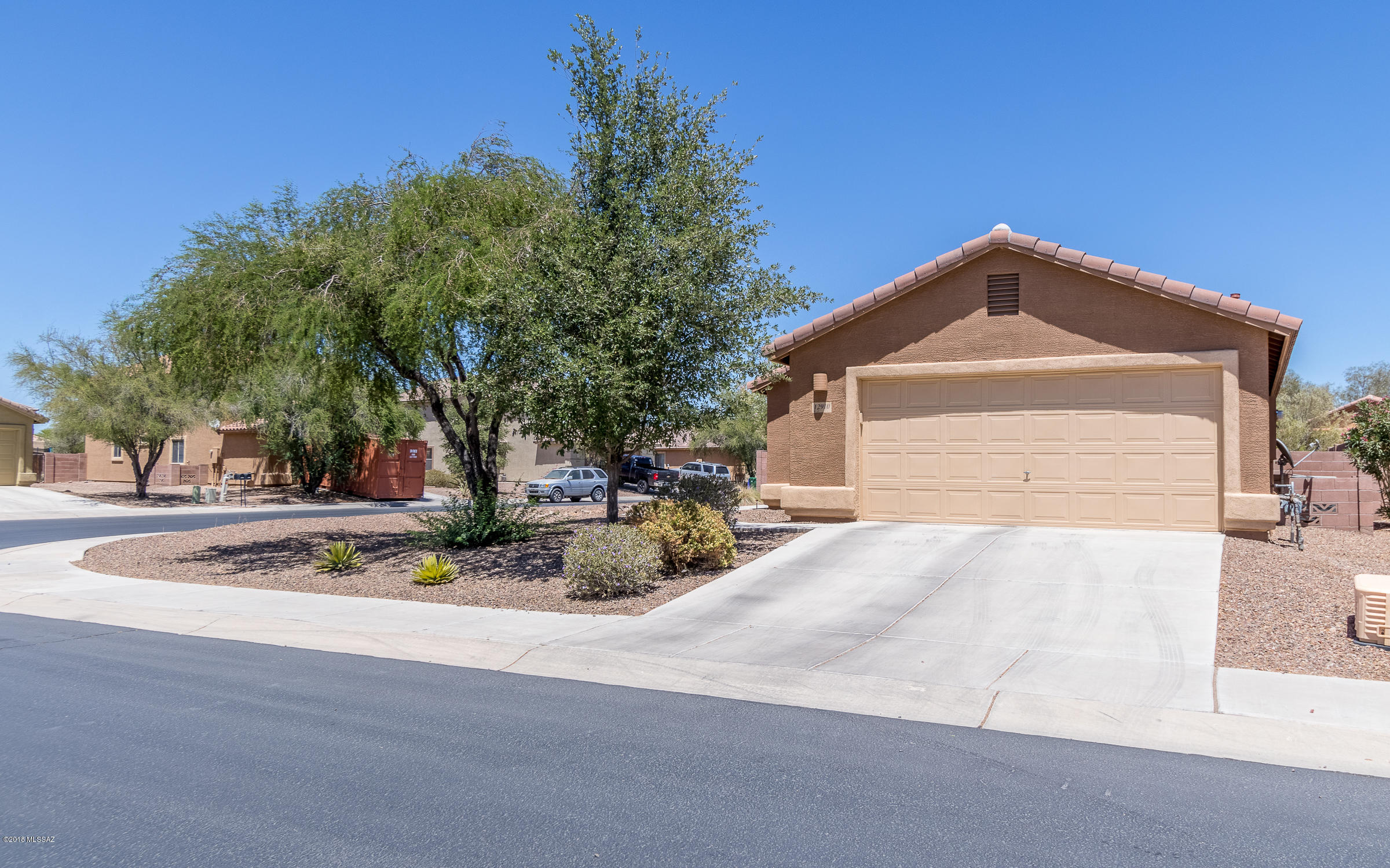 Beautiful family home ready for your enjoyment. Corner lot, no neighbors next-door!  Glistening, SALT-WATER, private, self-cleaning pool with pop-ups for cooling off this summer! Neighborhood park just up the street, tons of shade and grass for the kiddos to play. Covered patio, leads right to kitchen for perfect entertaining. Open, great-room floor plan. Den space off the foyer. 3 bedrooms, split bedroom floor plan. Neutral paint and flooring. Extra pantry space in hallway. Huge walk-in closet, private master with rolling shutters for maximum energy efficiency. 2-car garage with shelving storage. Water softener loop. Just minutes away from the Splash Pad at Marana Heritage River Park! Clean, ready to move-in! Buyer to verify all facts and figures, including those in MLS.