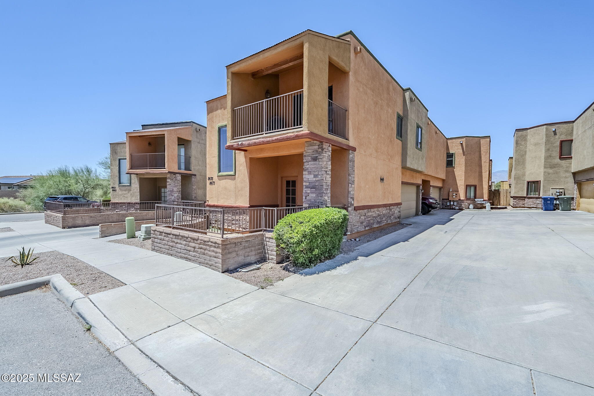 Contemporary living in this charming east side townhome. First floor primary bedroom has a large walk in closet and step in shower. Primary bedroom has a door to the covered patio. Second floor has the living room, dining room, kitchen with all appliances, 2 guest bedrooms and a guest bath with tub/shower combo. Spacious living room offers sliding patio door out to light, bright balcony. Dumbwaiter lift easily moves groceries, etc. from 1st to 2nd floor. Very urban floor plan with low maintenance yard. 2 car garage has an extension in one bay for additional storage. Refrigerator, washer & dryer included. Convenient to DMAFB. HOA covers roof, exterior building maintenance - including exterior paint, water, sewer, trash, pest control & common area maintenance. Great investment opportunity