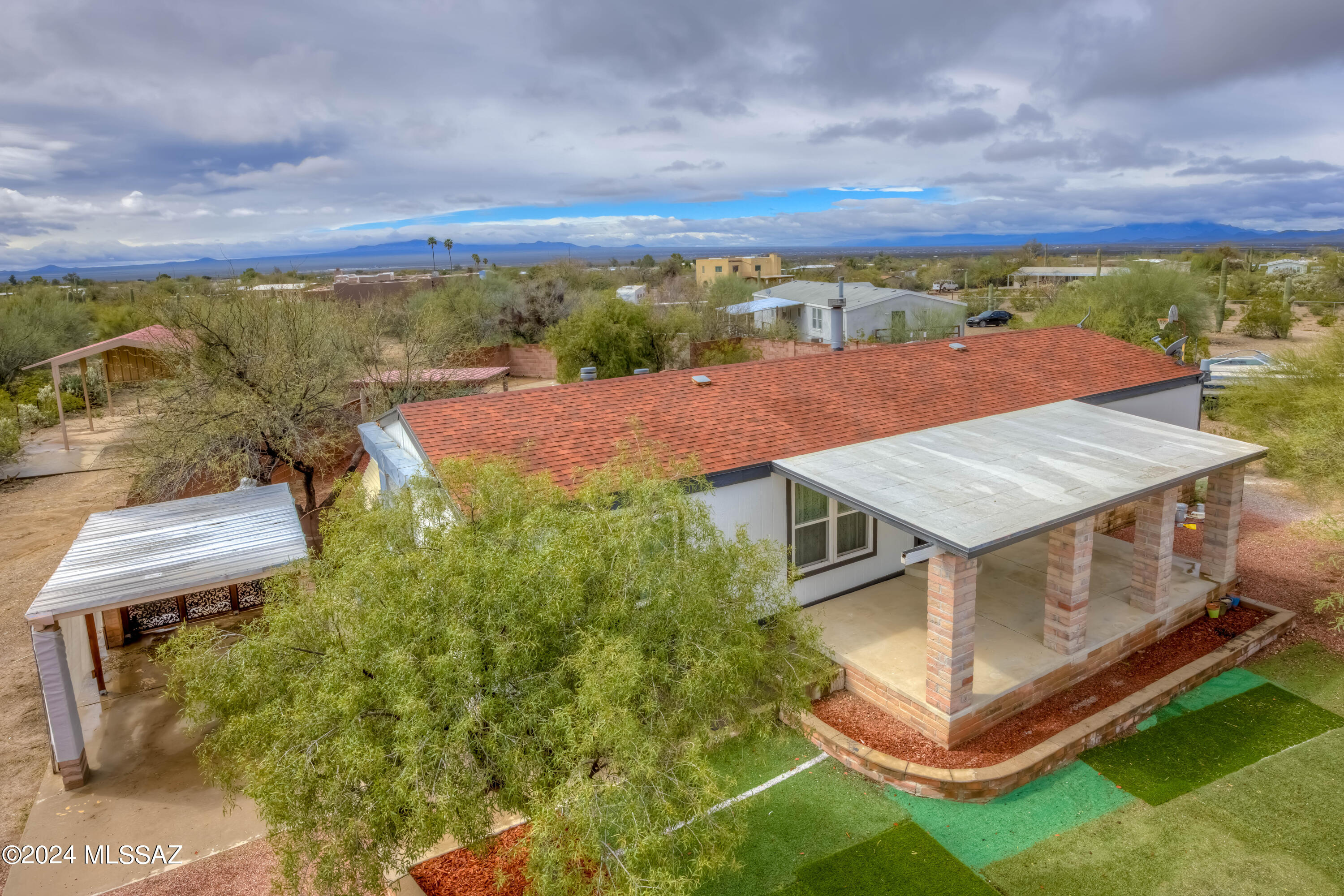 Escape to the tranquility of the Sonoran Desert with this charming 1988 Sandalwood double wide home, offering captivating wildlife, breathtaking sunset and mountain views, and mesmerizing starry nights. Nestled on nearly an acre of pristine desert landscape, this property embodies the essence of rural living at its finest. Inside, the well-maintained double wide home offers comfortable living spaces and modern amenities, providing a cozy retreat
after a day of exploring the wonders of the desert. With ample room for customization and personalization, this residence presents an opportunity to create the desert retreat of your dreams. Located in a tranquil setting yet just a short drive from city conveniences, this property offers the best of both worlds - seclusion and serenity combine with easy access to amenities. Whether you're seeking a full-time residence or a weekend getaway, this Sonoran Desert gem promises an unparalleled lifestyle surrounded by nature's beauty. Experience the magic of desert living in this charming oasis - your slice of paradise awaits!