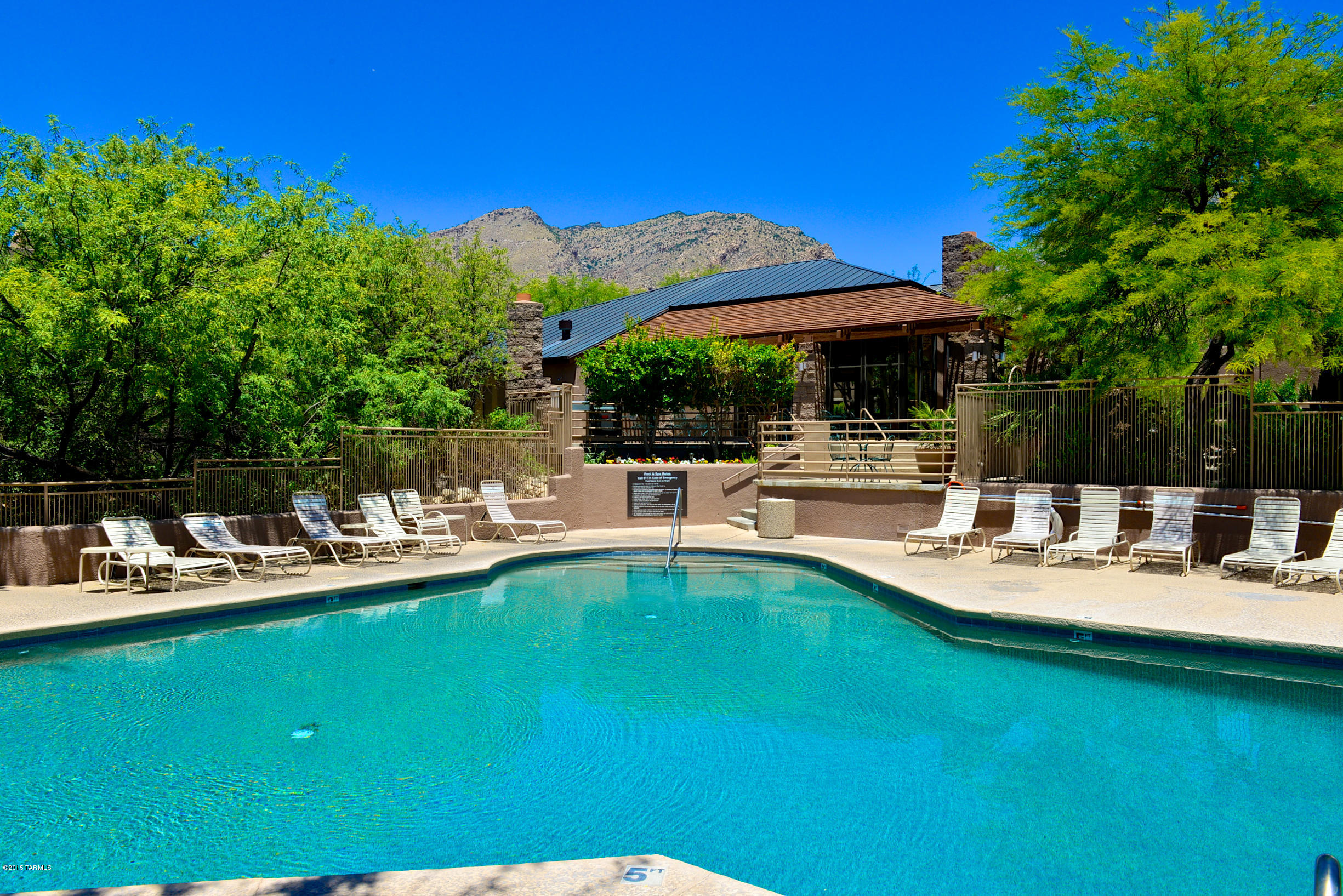 Resort living at its finest, next to Loews Ventana Canyon Resort and at the base of Catalina Foothills.  Private 2 bedroom and 2 baths, split bedroom plan with mountain views and beautiful mature landscaping. Unit features large picture windows, SS appliances, french doors to covered patio and a pantry closet. Ideal location with unit facing north. Close walking distance to 2 club houses with kitchen, 2 pools/jacuzzis, a fitness center, tennis court, business center and a private  gated entry to Vantana Canyon trail. HOA covers roof, exterior maintenance, trash, water sewer and fire protection.  Close to Ventana Country Club, resort, numerous golf courses, hiking trails and shopping,yet nestle in a quiet enclave. Great 2nd home or for young executive.