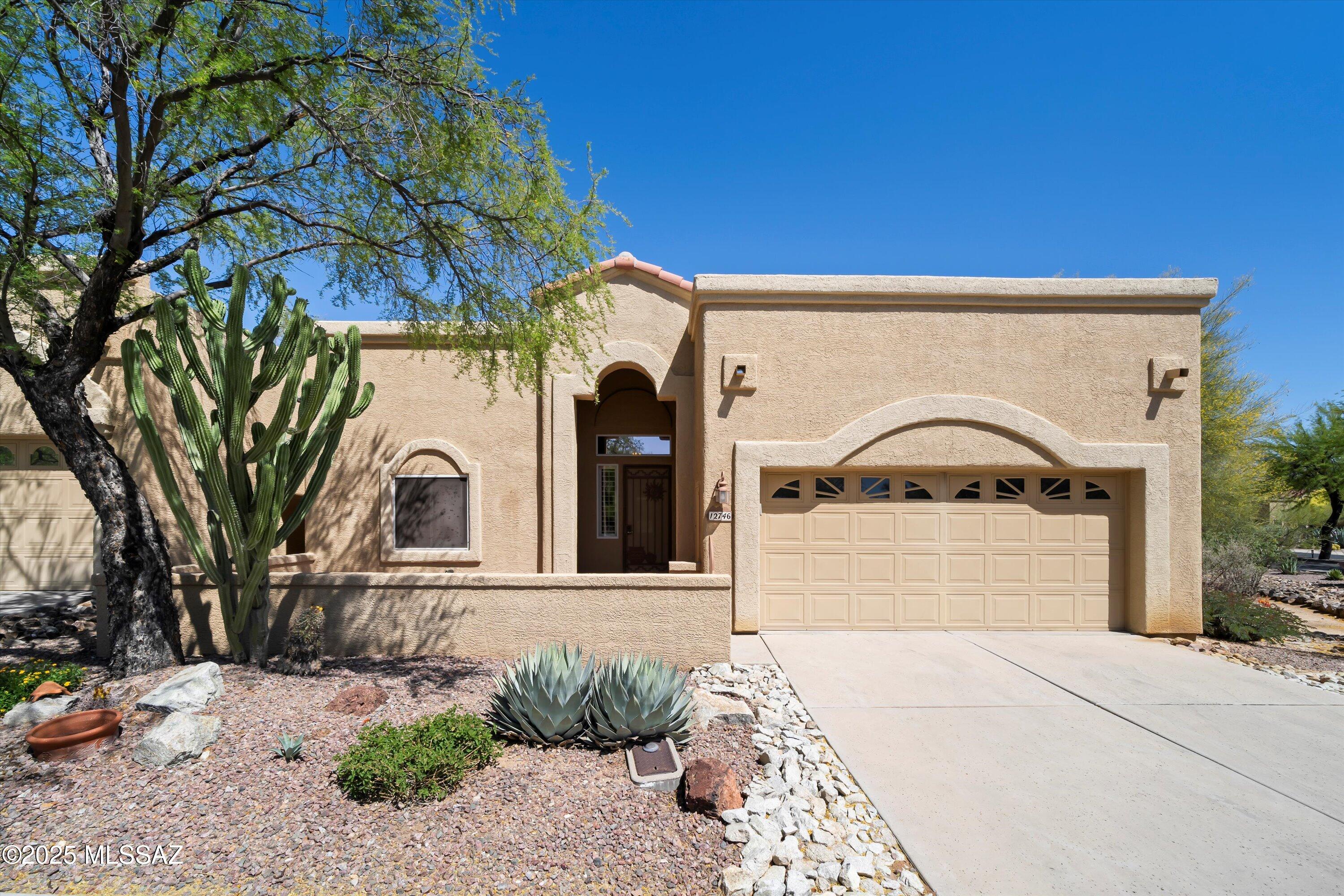 Exceptional 2BD/2BA+den (2024 sqft) townhome located in highly desirable gated Vistoso Hills. Welcoming courtyard flows to open concept plan. Embrace the spacious great room with gas fireplace and formal dining area for entertaining. Gourmet kitchen showcases granite countertops, custom tile backsplash, breakfast bar, ample cabinetry and sleek appliances.  Luxurious owner's suite boasts ensuite bath with double vanities, walk-in shower and closet. Split floor plan allows guest complete privacy.  Jack-n-Jill bath allows easy access to den/office. Beautiful shutters throughout. HVAC and water heater new 2023. Retreat to a tranquil covered patio and backyard.  This lovely corner lot home is a quick walk to community pool to take in unbelievable mountain views.  Truly a Must See!