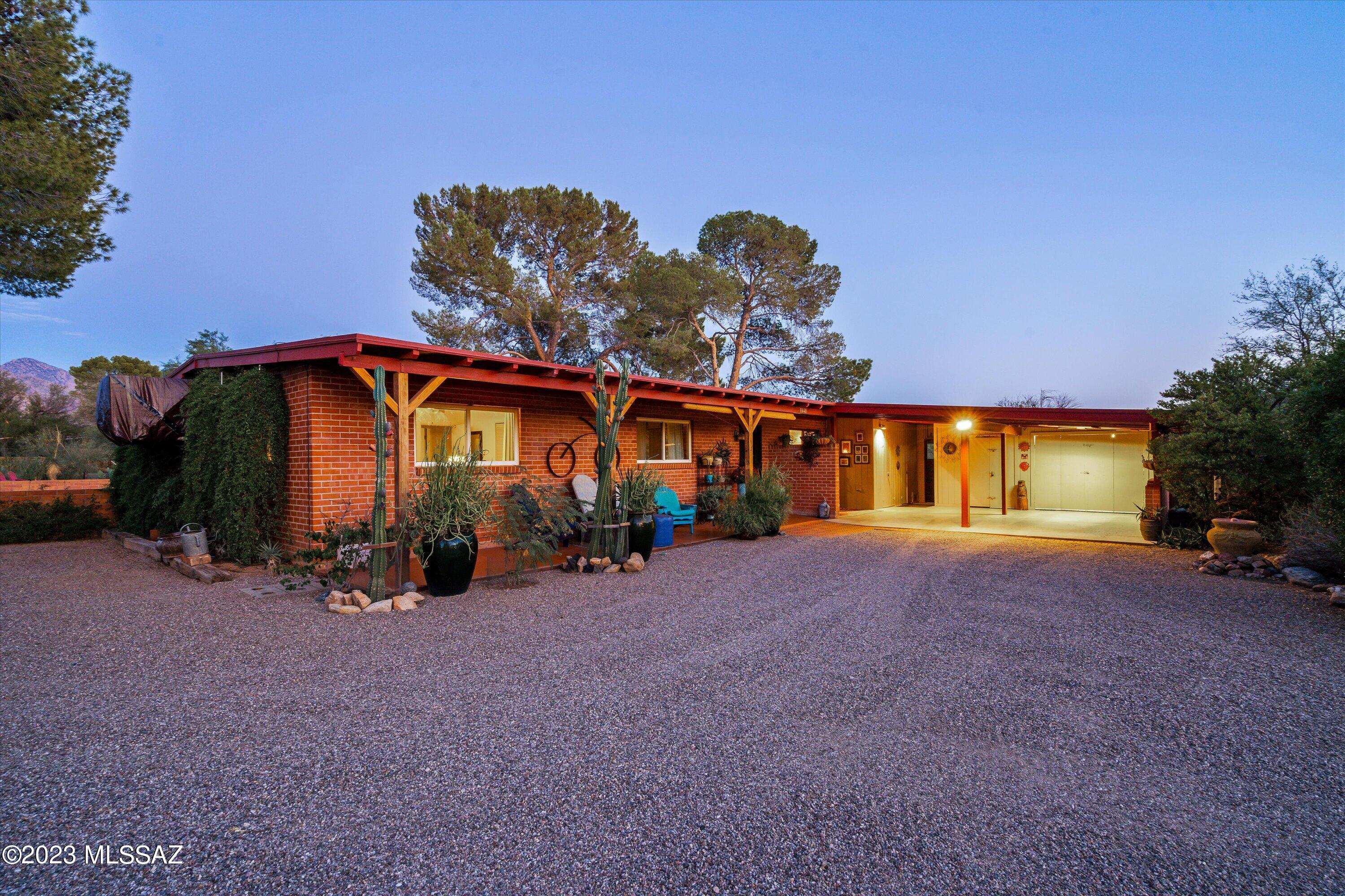 Amazing 3/2 horse property close to everything. Inside this home shines with quality and character throughout. True hand-made custom mesquite cabinetry complement the large kitchen. Wood beams offer sophistication in living spaces offering premium living. Bedrooms are well proportioned with space. Primary bath and guest bath have been completely redone providing spa like experience.

Built with double brick this home is built to last. 
Outside this home lives as well as any we have ever seen!  The Arizona room takes you back to another time. A massive pebble-tech swimming pool perfect for all day enjoyment. Horse stables, amazing landscaping with room to add make this a must-see property. 41 saguaros also dot the landscape. 
Priced to sell schedule your showing today!