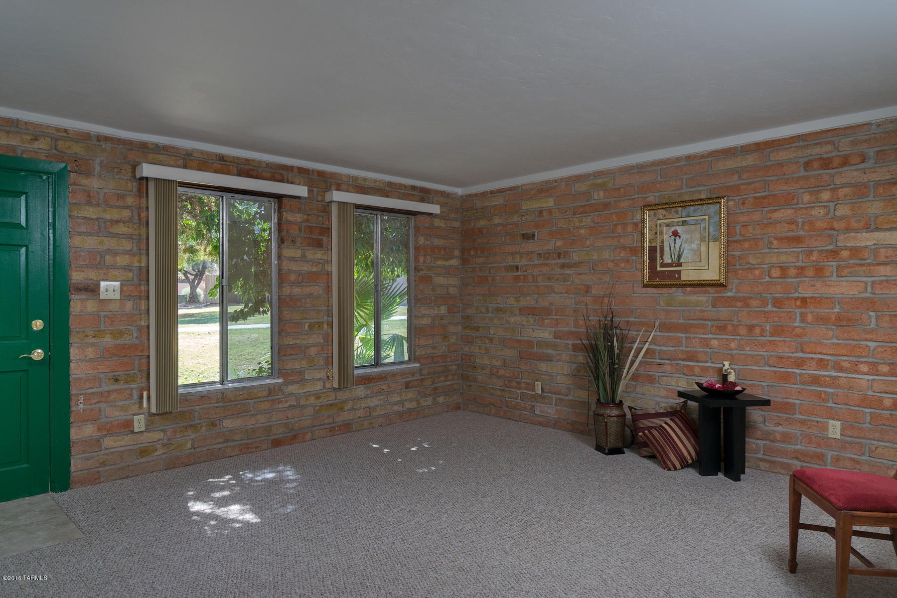 Fabulous single story townhome on the first floor in The Meadows! This east facing townhome has large shade trees, mountain views, new carpet, new paint, new stove, new disposal, new dishwasher, new bi-fold closet doors. Home offers one covered carport space, carport storage cabinets and storage closet. Roof recoated in 2016. Community has two community pools and your HOA fees pay for the common area maintenance, water, hot water, exterior building maintenance including roof and common area insurance. Target, Albertsons, Quik Trip, Trail Dust Town, Chik Fil-A and more all nearby!! Seller is a licensed Real Estate Agent in the State of Arizona. Buyer to confirm financing.