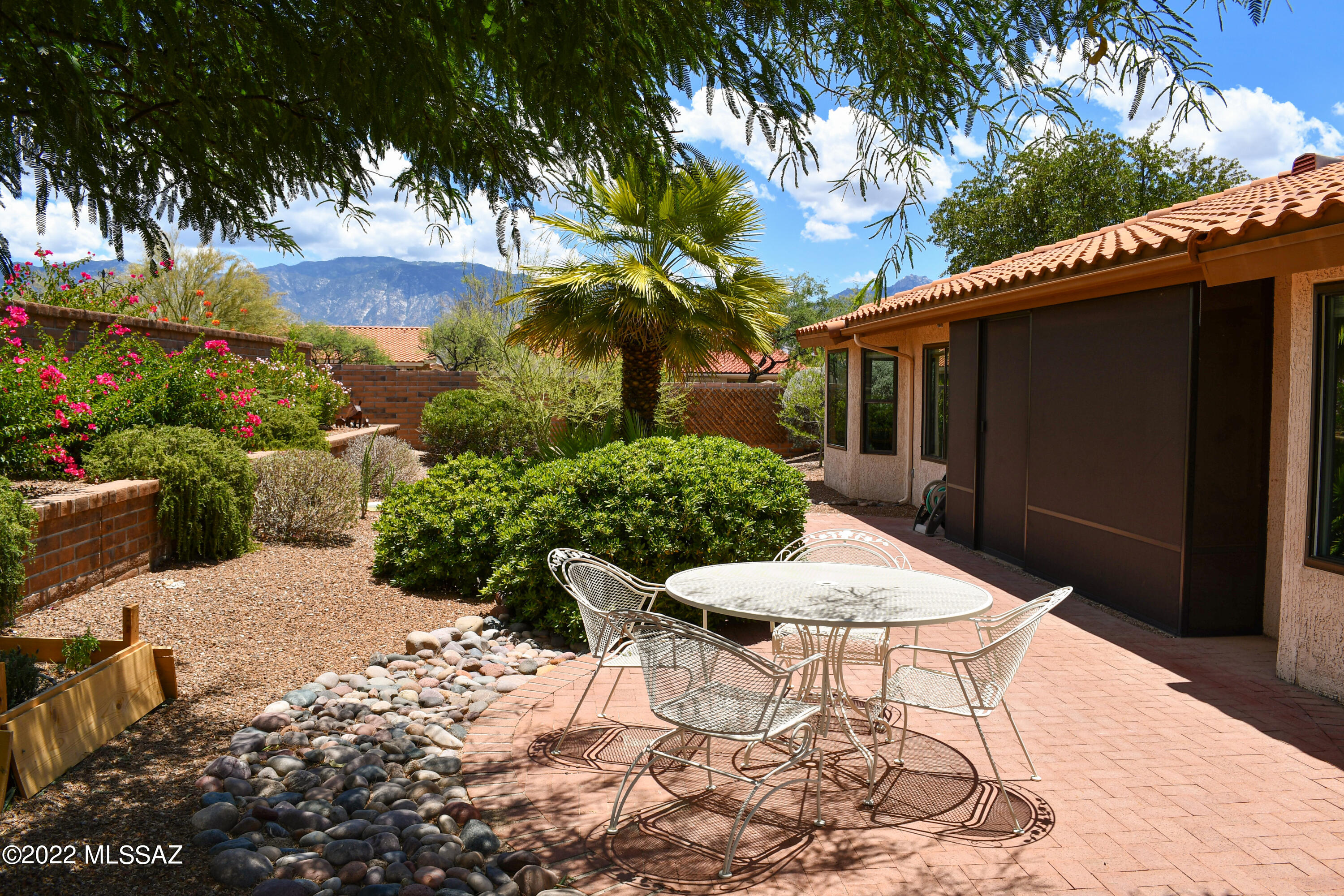 Beautiful Expanded Silvercreek Model in Sun City Oro Valley on a Corner Lot with Mountain Views. Recently Renovated Kitchen with New Soft Close Hickory Cabinets, Granite Countertops, Stainless Steel stove and Microwave. Breakfast Nook with Bay Windows Capturing View. Primary Suite with Bay Windows and Walk-in Closet. Ensuite Bath with Updated Shower and Dual Sink Vanity. Cozy Family Room. Open Living Room with Inviting Corner Fireplace. Dining Area for Entertaining. Vaulted Ceilings Throughout. Den, Office, and Laundry Area with Utility Sink. Fabulous Outdoor Living Space with Screened in Porch, Meticulous Landscaping and Extended Paver Patio. Newer windows, HVAC 2018, Owned Solar 2020. Resort Style Community Amenities. Start Enjoying The Sun City Lifestyle Today in This Wonderful Home.