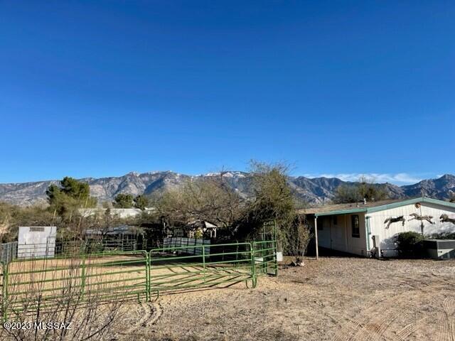 You will NOT find a better horse property for even close to this price!! 6 stalls +  an arena, large round pen, professionally set up mare motel. entire property is fenced off and has  an electronic drive through gate.  Home and property are offered in ''as is'' condition, estate sale, current owner has never lived in home.  Property and home are very clean and livable but some appliances are missing and property could use some TLC, inspection attached but seller will not do repairs and priced the home accordingly.  Split bedroom plan with 2 spacious bedrooms PLUS a den (could be 3rd bedroom) Backyard is fenced separately & has a shed, side yard is also fenced.  Tree house for kids.    Paved roads up to the driveway, great riding areas nearby! Septic already certified! prefer cash.