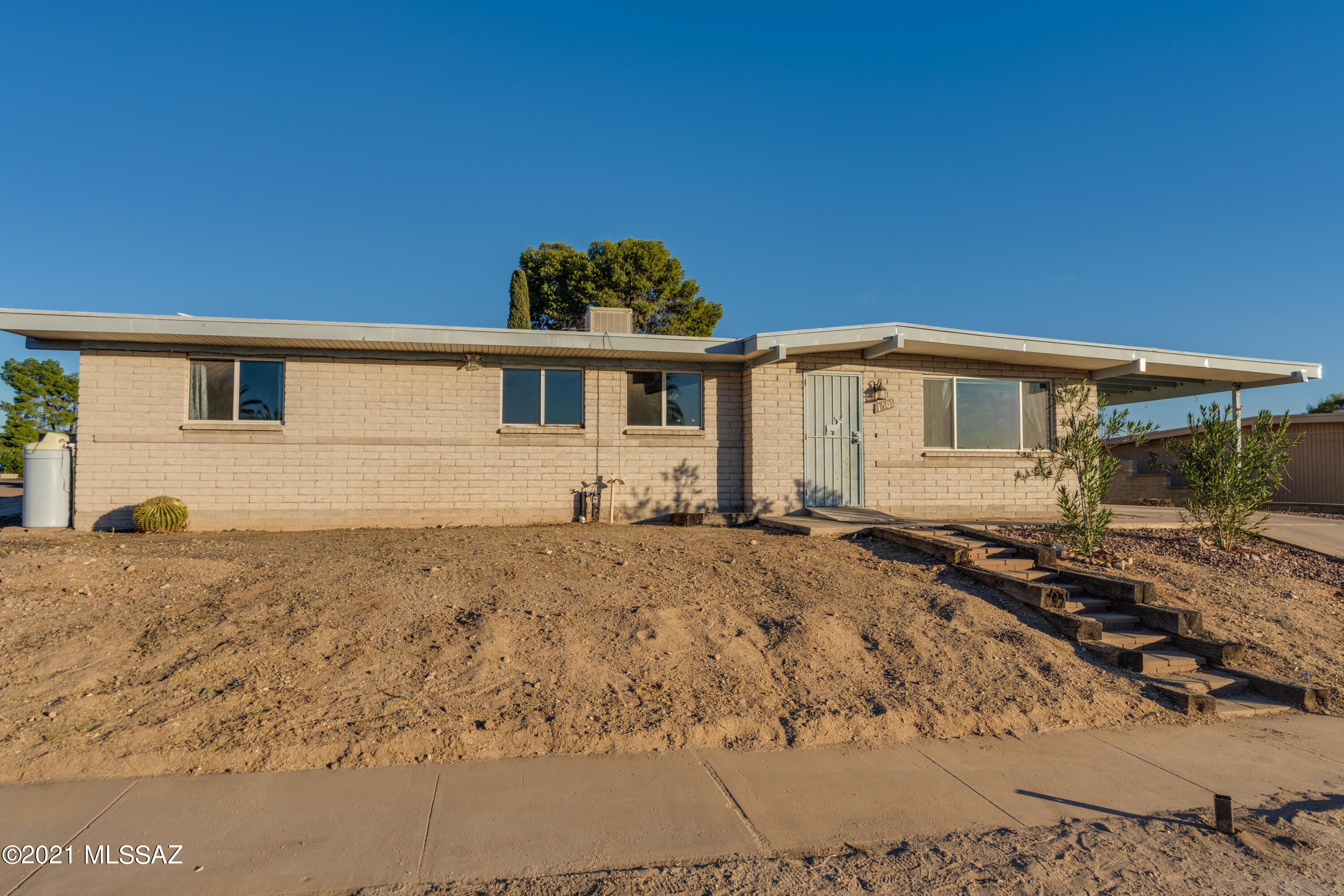 Tons of potential 4 bedroom 2 bath ranch on large corner lot. Bonus 13x25 enclosed unpermitted Arizona room is not included in square footage.  SOLD AS IS-seller will not make any repairs.  Condition of empty pool and spa is unknown.  Pool was in working order when drained a number of years ago. Heated Pool and Spa
Hot water heater replaced in 2021
HVAC system installed 2016
Evap Cooler still connected sold as is.
Previously was tenant occupied and was not well cared for or cleaned regularly during that time.