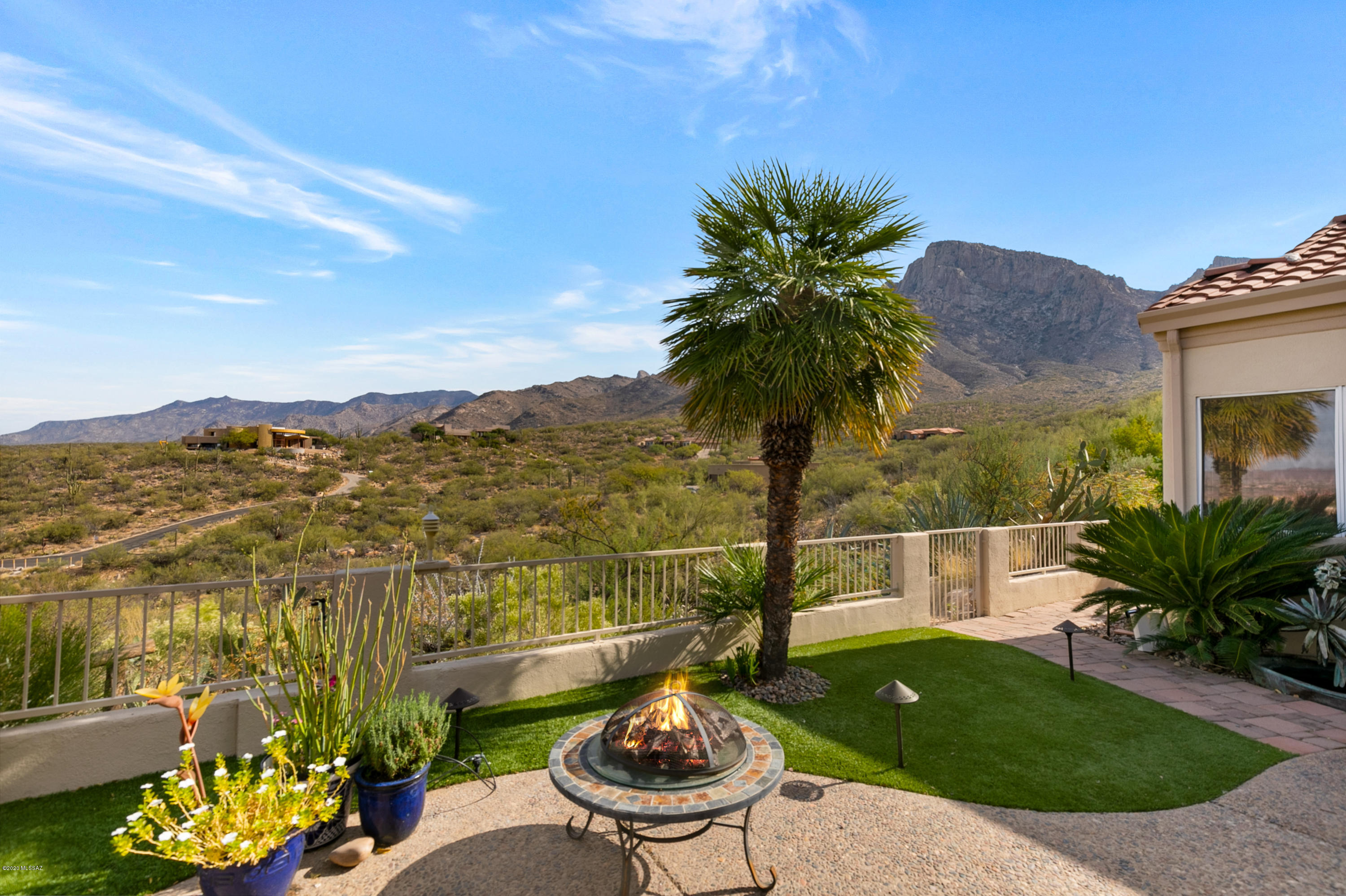 Prime VIEW location at the top of the hill, on a quiet, peaceful cul de sac, in gated La Reserve. Most ideal NORTH facing location provides shade during afternoons, views of the Catalina Mountains changing colors at sunset and the Moon over the Ridge, an open Canyon and the city lights at night below. Flexible floor plan, great for entertaining, 2 master suits, split bedroom layout plus third room, a den and a LOFT. French doors from third room to patio/outdoor living area. Beautifully updated kitchen with island, wet bar, 42'' Alder cabinetry, stainless steel appliances, wine cooler, access to covered patio. Great Room design with a see-through fireplace, expansive wall of windows that capture dramatic Mountain views Wet Bar adjoins the great room. Backyard also offers great outdoor entertaining with artificial turf, a Palm tree from where you can see the Mountain changing colors at sunsets ...New Roof and dual HVAC in 2016, see additional document for list of updates. Additional 110 square feet LOFT is not included in MLS sqft. Wall Mount TV in kitchen, outdoor speaker system, 2 storage sheds, water fountain and most outdoor potted plants can convey with home. Additional Loft area currently used as office/bonus room: approximate 110 square feet NOT included in MLS square footage. There is an attic in garage for additional storage. 3rd room offers a flexible floorplan option, currently used as formal dining room but a closet can be added upon buyers request