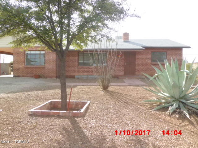 Wonderful opportunity to own this home on a very large lot.  Home offers 3 bedrooms, 2 baths, a very large living room with fireplace and separate family room with a second fireplace; with this layout the family room could be used as a 4th bedroom if needed with a Jack & Jill bathroom. The furnace and water heater are newer. There is also a built-in laundry hamper among other built-ins adding more charm to this lovely home.  There is a single carport with recently painted floor and plenty more space for parking in driveway. Covered patio & a very spacious backyard with separate fenced dog run, is fully enclosed with block wall and there is access from the alley with a cement pad off the double doors. Don't wait, come see your new home today.
