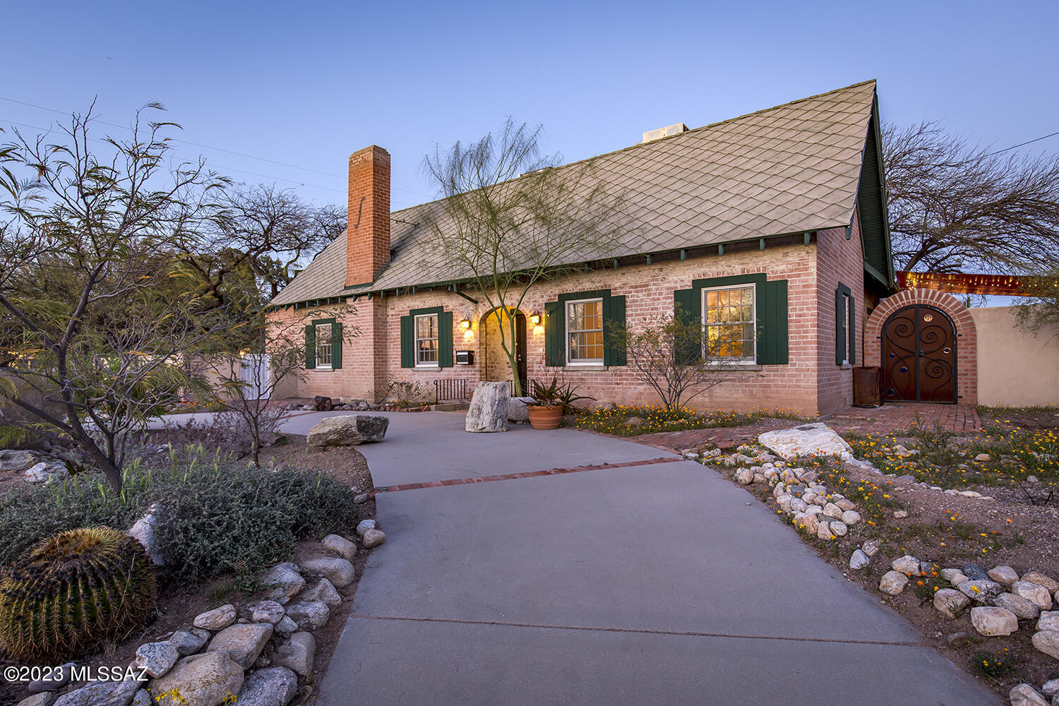 Grand historic, brick Tudor in Sam Hughes, walled-in, private, .42 acre lot. Showpiece, open, Living Rm w/ Dutch Hip, 12' ceiling & FP & sep, inviting den/sitting rm. Large dining rm area w/French drs. to colorful, courtyard patio. Spacious, remodeled kitchen. Original wood floors. Primary Suite w/dressing rm & 2nd, large br & guest ba on 1st floor. 2 large brs, den/kitchenette, loft, bath & balcony on 2nd floor. Basement exercise/wine cellar/art studio rm. Multiple covered patios & fruit trees, colorful beehive fireplace w/outdoor kitchen & counter. 3 car garage w/utility sink, work area & retractable stairs to spacious attic. Fenced pool & storage shed & then huge backyard suitable for any sized guest house & / or basketball court or whatever 1 wishes. 2 blocks to Himmel Park.