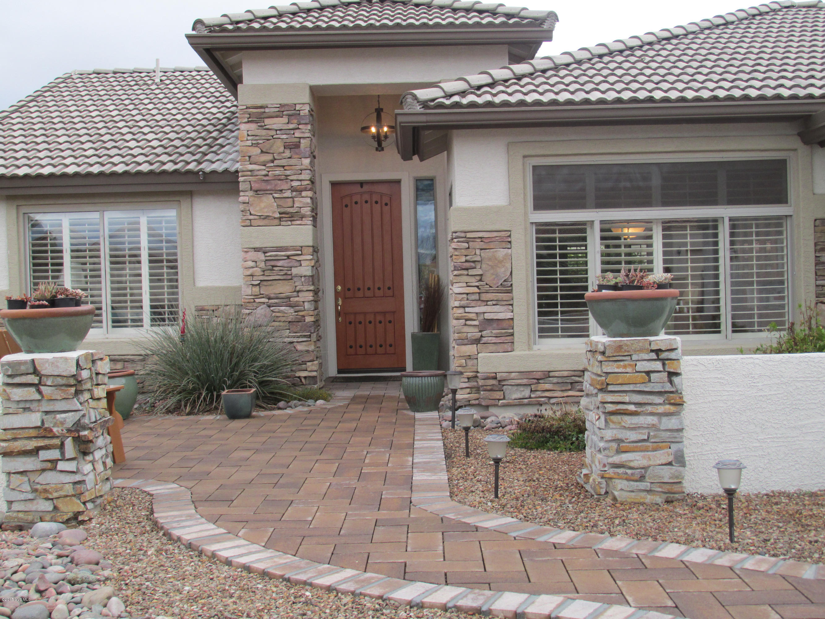 Popular Expanded Laredo Model on a Desirable Corner Lot with beautiful Front Landscaping with lots of Curb Appeal. The Interior features a Great Room with Built-In Entertainment Center and shelve lighting. Kitchen with Engineered Stone Counters, Island, Gas stove, Tile Floors and Mountain View from Kitchen Nook. Shutters on all Windows. Large Master w/Walk-In Closet, Master Bath w/Dual Sinks & Tile Counters, 2-Car Garage with Cabinets, Epoxy Flooring and Utility Sink. Very Private Rear Yard, Full Length Patio with Flagstone, Built-in BBQ, Water Features & Partially Fenced Rear Yard. Enjoy this beautiful home in a great Adult Community with lots of Activities, a Fabulous Clubhouse, Fitness Center, Pool/Spa and several newly built Pickle Ball Courts.