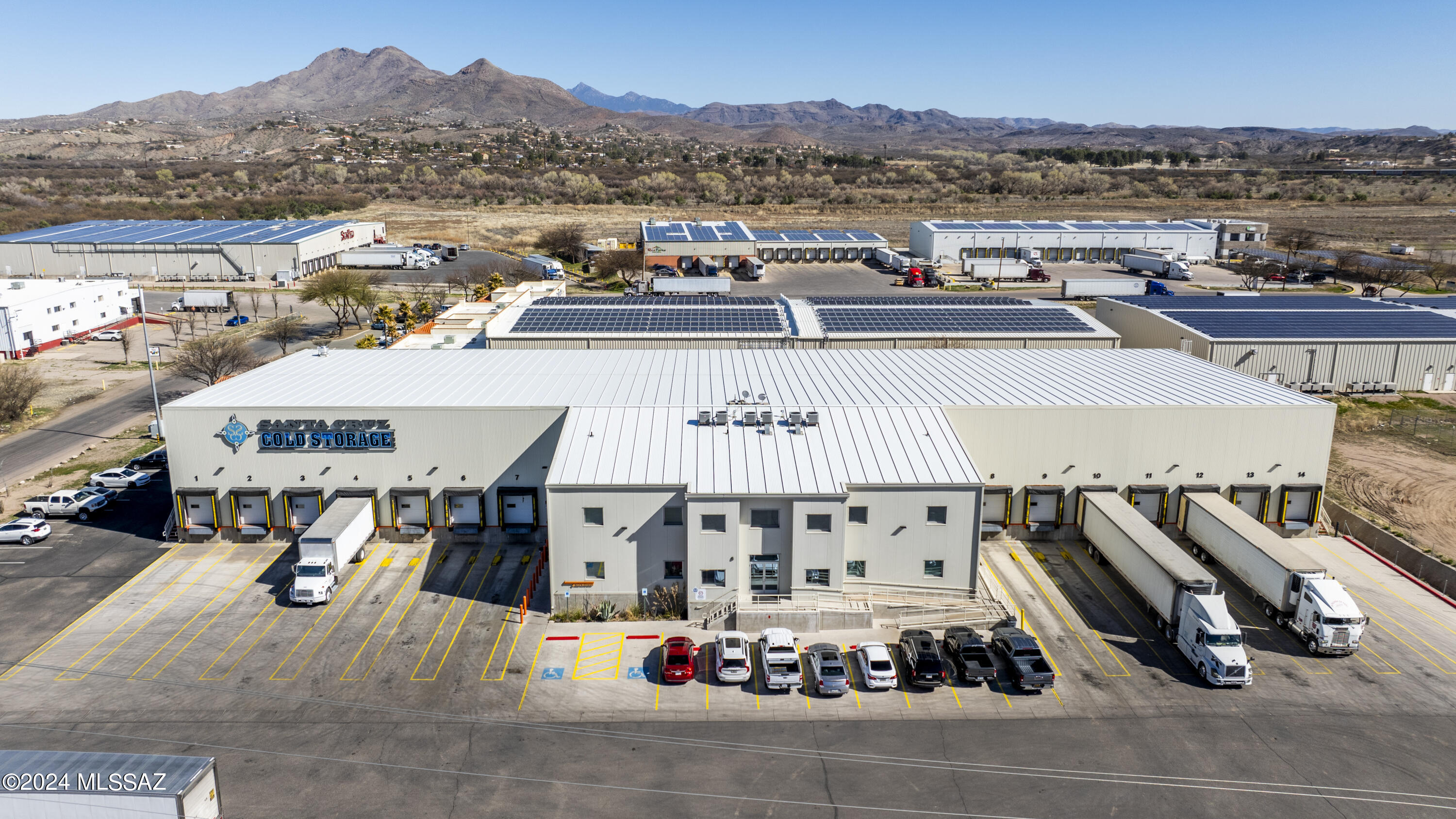 Welcome to Rio Rico Industrial Park, where opportunity meets convenience. This cold/dry storage facility situated on 2.3 acers offers visibility off the Frontage Rd. has a total area of 33,641 sq. ft., of which 18,750 sqft is cold.   The property is poised to accommodate your business needs with ease. With 20+' ceilings, & an expansive floor plan, this facility offers ample space for storage/distribution activities. Streamline loading & unloading operations with 14 -8x9' dock doors, ensuring efficient transportation logistics. Enhance productivity w/ dedicated office space spanning 7,200 sq, ft.  Accommodate employees & visitors w/ ease, courtesy of 32+ parking spaces available on-site. This facility presents an exceptional opportunity for businesses seeking a strategic location.