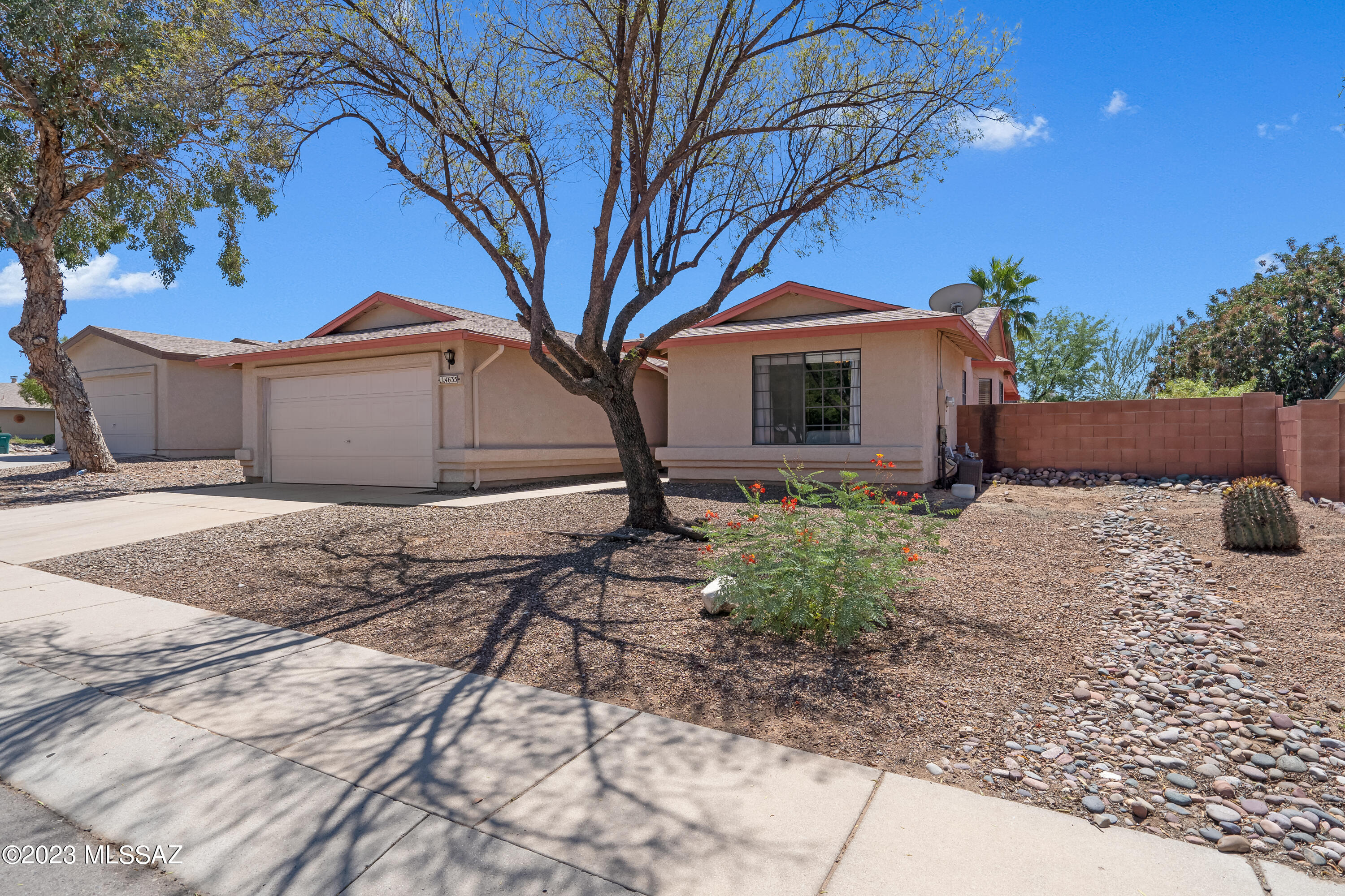 Clean and move in ready! This lovely southwest contemporary home in Sunset Point features a newer AC (2yrs old or so),plumbing lines replaced in the last 5 years (no polybutylene), wood laminate flooring, kitchen with new dishwasher, gas range, updated primary bath, vaulted ceilings that let in the natural light, and a large backyard with covered patio, turf, and native plants. Split bedroom floor plan, and 2 car garage, community pool, and large park/playground!  The termite warranty was just renewed and will convey at no charge to new owner. Convenient northwest location close to all amenities.