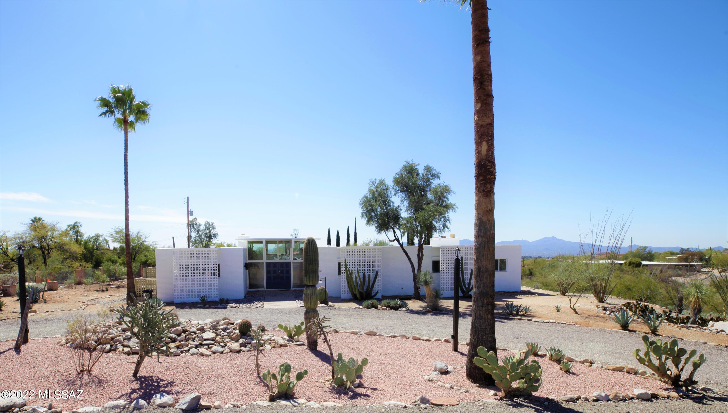1965 wold fair show house with mid century design. 3492 sqft home with bonus room connected to garage. Huge Catalina mountain and sunset views. Split 4 bedroom and 3 bath home. .84 acre corner lot in cul de sac.  Come see it today. owner agent.