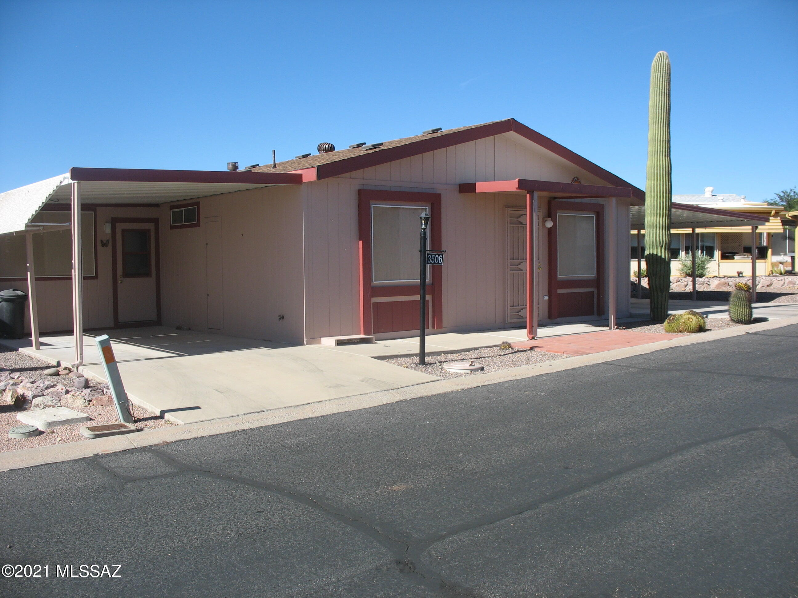 Recently updated 2 bedroom 2 bath home with fresh paint and new flooring.  Includes a ducted heated and cooled 11 x 13 AZ room and a nice 8 x 11 workshop.  This home sits on a large triangular lot and has a double carport to the north and a single carport to the south.  Copper Crest is a gated 55+ Active Adult Community which includes swimming, spa, shuffleboard, pool table, work-out facility, hiking and biking, and more. And, all within a short distance of Tucson.  And you own the land!