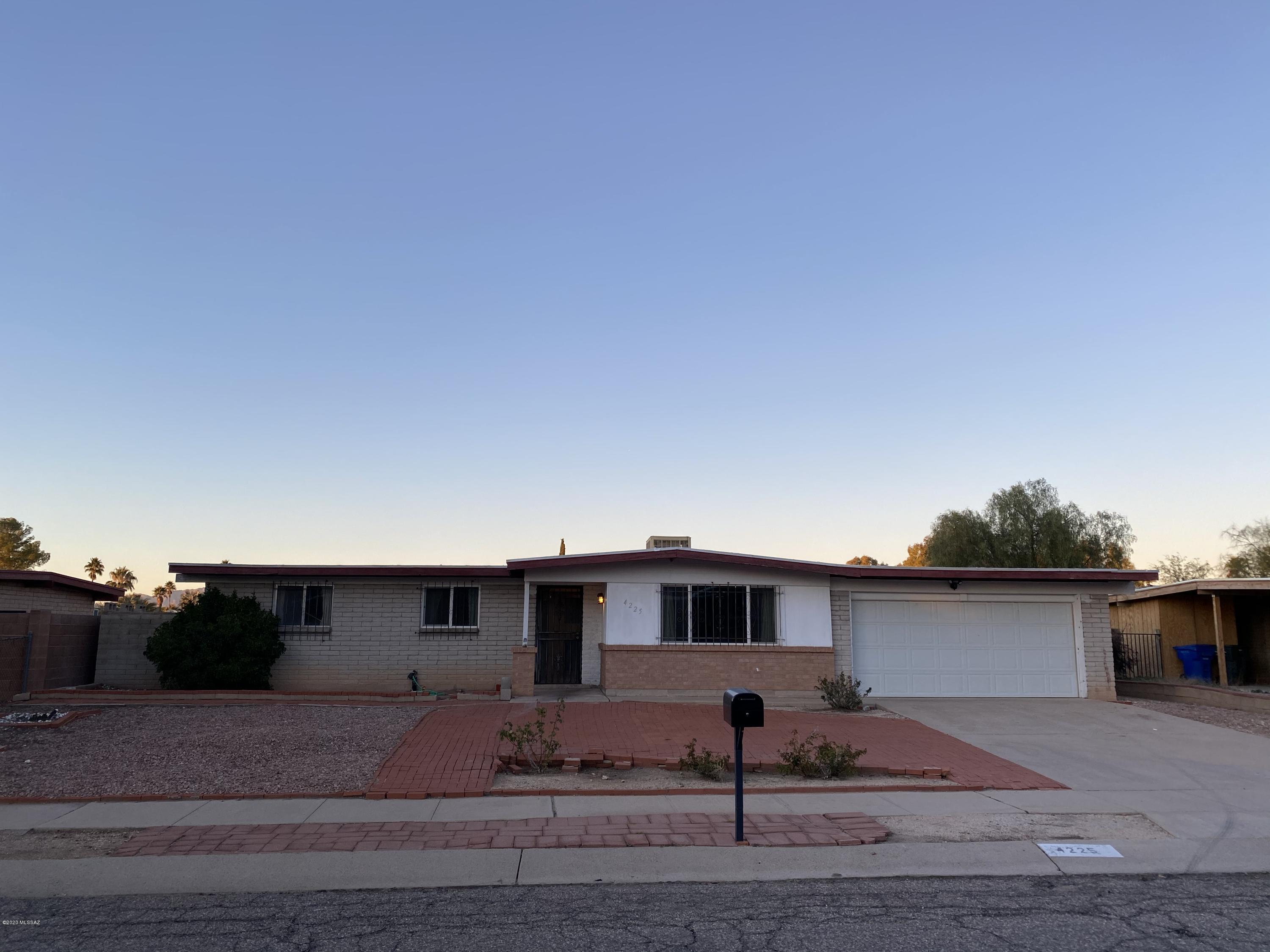 Pine Grove with views of the Catalinas 4 bedroom 2 bath 2 car garage and a pool.