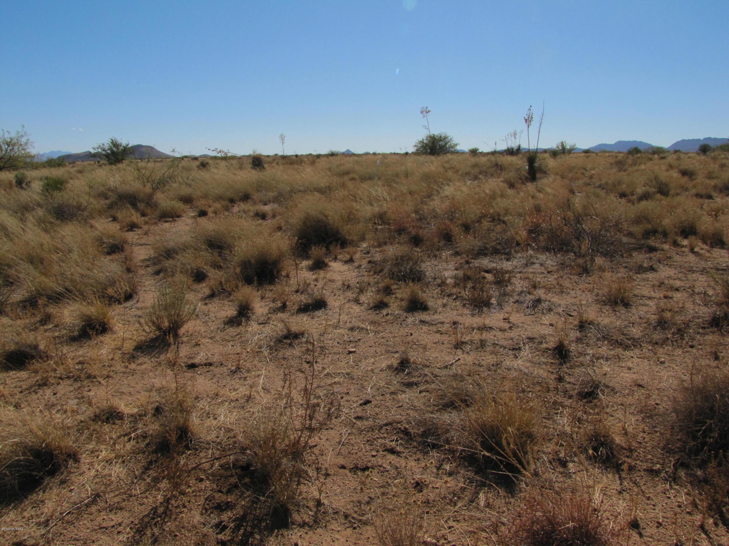 Residential lot just a few miles outside village of Sunsites with unimpeded views of Cochise Stronghold. Views of the rest of the valley and surrounding mountain ranges as well.  A few houses in the area.  Starry skies and mild temperatures await.
