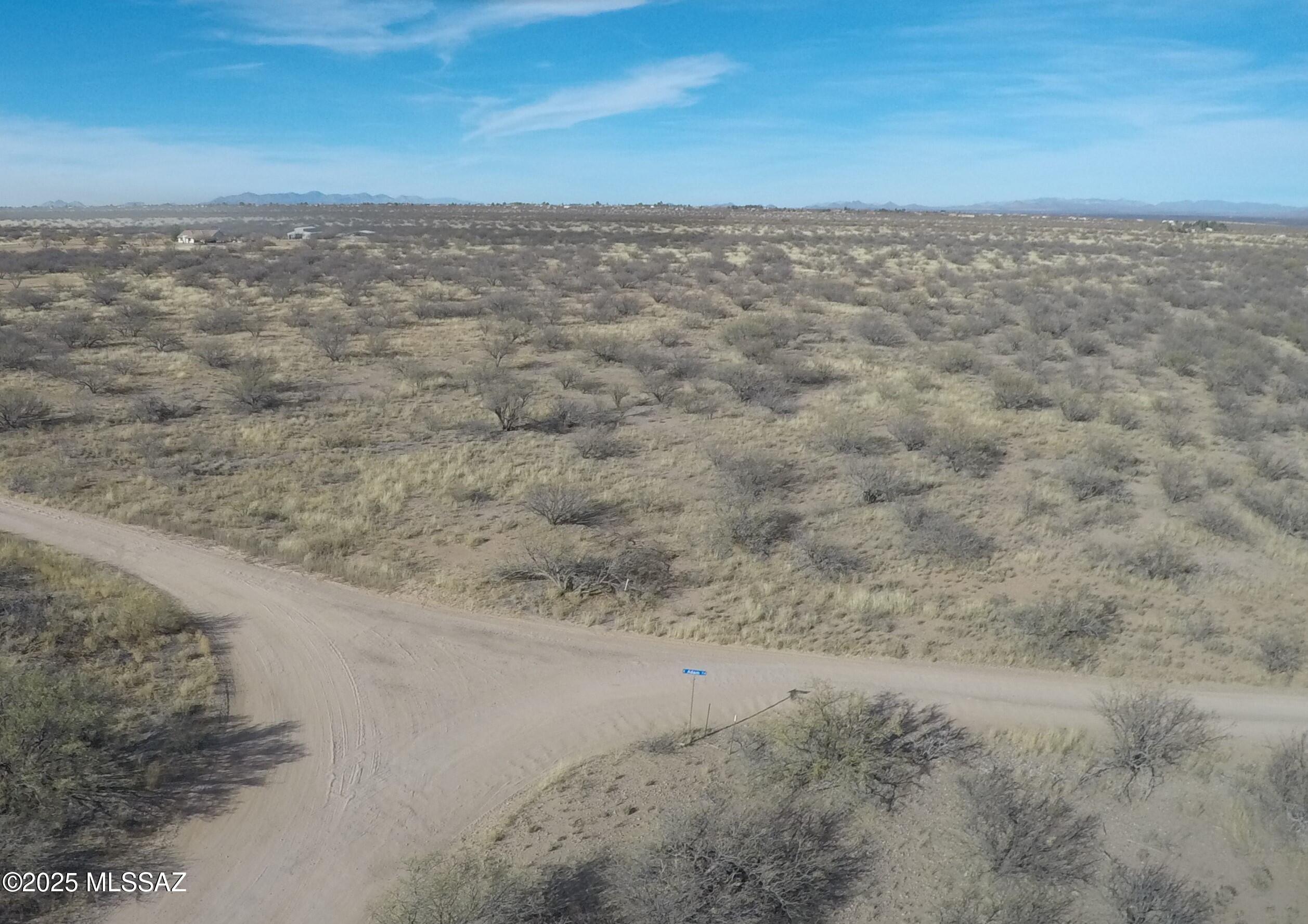 Welcome home to your 20 acres of Arizona sunsets and mountain views in a gated community with site-built homes only. Power at the lot line and backing to a wash on the northwest corner. Flat portion for easy building. Own your piece of the old west with incredible views, high-speed wireless internet available in area, power, and tranquil star-filled nights.
