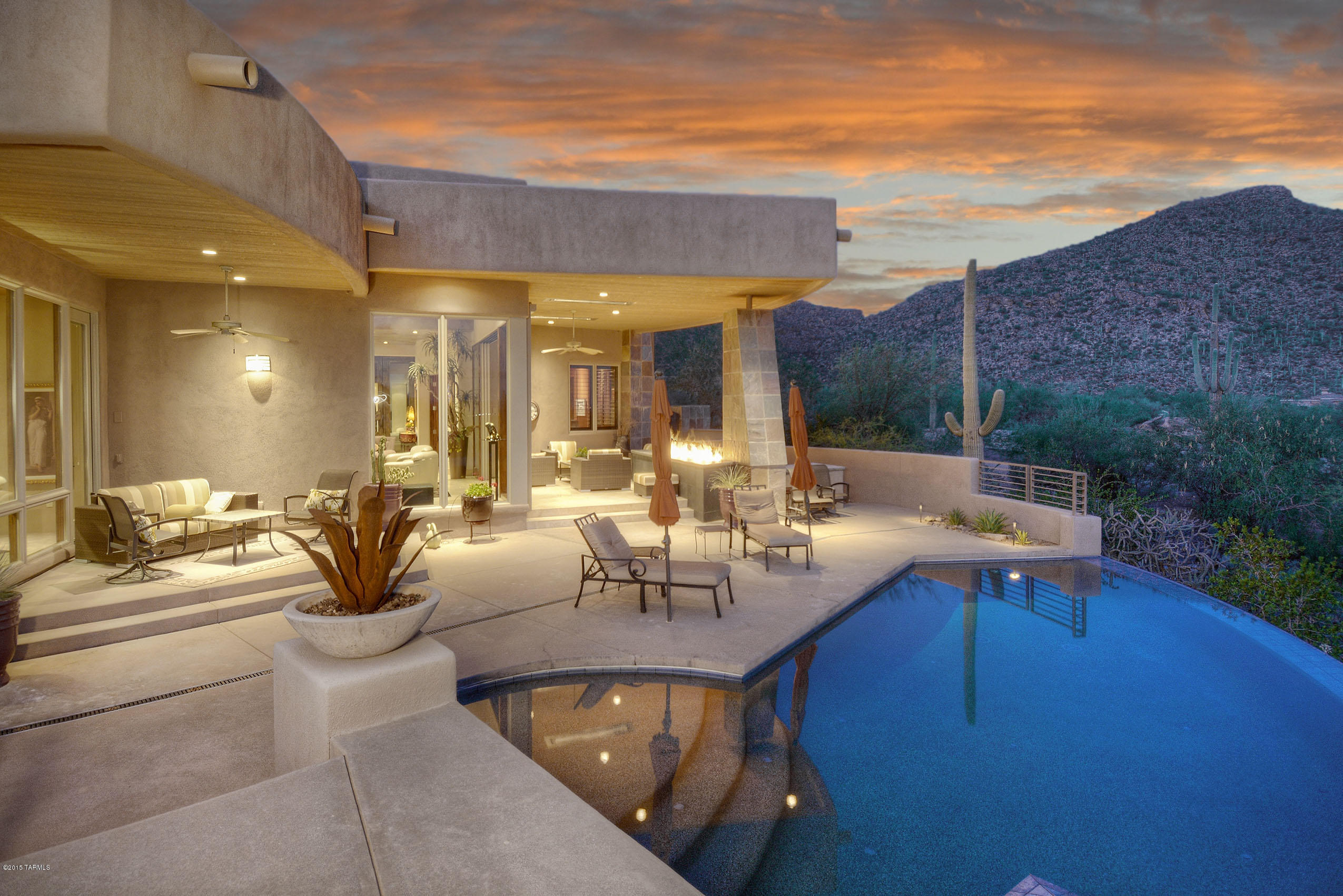 *CONTEMPORARY MASTERPIECE* STUNNING ESTATE COMBINES THE BEAUTY OF THE SONORAN DESERT W/ELEGANCE OF MODERN ARCHITECTURE!AWARD WININNG ARCHITECT MARC SOLOWAY/QUALITY BUILD BY LATHREM HMS-BOTH CREATED A TRUE DESERT EXPERIENCE!DESIGNED W/WALLS OF WINDOWS & VANISHING DRS TO ENJOY BREATHTAKING  DESERT TERRIAN- BRINGING THE OUTDOORS IN!BEST VIEWS IN CANYON- MAJESTIC MTN RANGES/VALLEY LIGHTS,& YOUR OWN PRIV HILLSIDE PATIOS!WONDERFUL ''GATHERING ROOM'' PERFECT FOR CASUAL LIVING, OPENS TO EXQUISITE GOURMET KIT W/BLEND OF WOODS,SS APPLIC,DINING AREA W/UNIQUE WATERFALL LIGHTING!NATURAL STONE/SLATE ACCENTS/FLRING,ARTISTICALLY DESIGNED METAL/EXOTIC WOOD DRS/BUILT IN'S!RESORT BKYD-VERANDAS,MESMERIZING FIRE-LINE,ALFRESCO KIT-BBQ,RAZOR EDGE POOL/SPA & VIEWS GALORE!SPLIT BR FLRPN-ALL GUEST SUITES!FLRPN AVAL THIS AMAZING HOME BOASTS SUCH UNIQUE FEATURES AND DESIGN...FABULOUS DECORATING/& COLORS THAT ARE INSPIRED BY WESTERN SKIES- FEATURED IN SEVERAL HOME PUBLICATIONS-LUXE, DESERT LEAF! SOME FURNISHING ARE AVAILABLE FOR SALE! MASTER RETREAT OFFERS A TRANQUIL SITTING AREA- HIGHLIGHTED BY INCREDIBLE CATALINA VIEWS, HUGE WALK IN SHOWER,SOAKING TUB, HIS /HER SEPERATE VANITES & DREAM CLOSET! TONS OF UPGRADES & DESIGNER FEATURES... WELCOMING COUTYD WITH SOOTHING ZEN WATERFALL, INTERESTING CEILING DESIGN/SOFITS, CUSTOM LUITON LIGHTING SYSTEM,OVERSIZED 3 CAR GARAGE W/STORAGE RM & MUCH MORE!