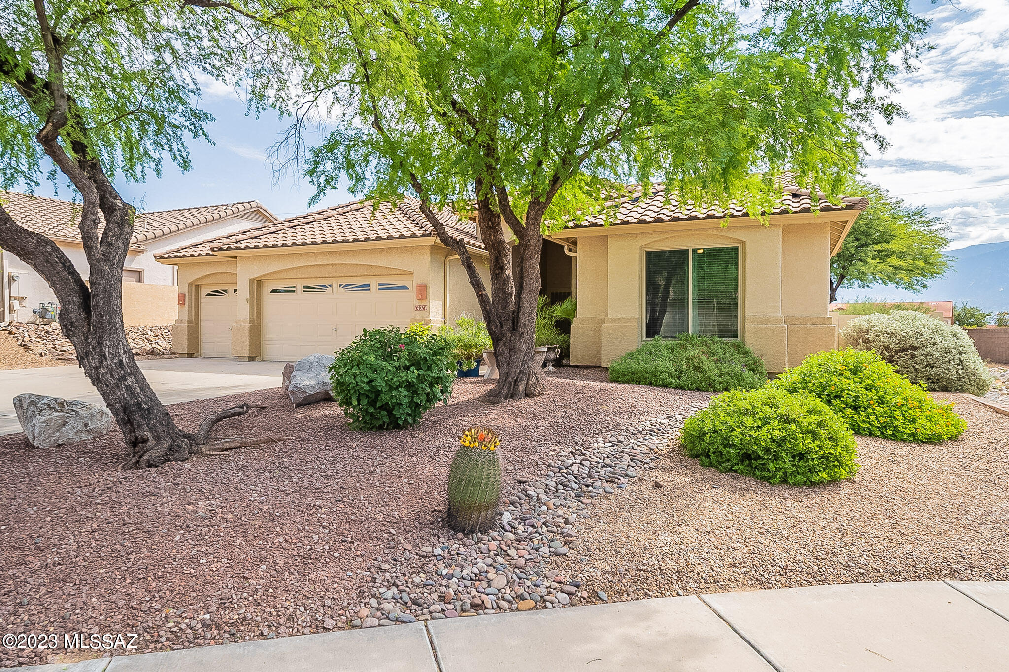This beautifully updated jewel of a home is on a private lot with impressive mountain views. Step inside to find elegant neutral tile gracing the entire home.  Welcoming Kitchen has been tastefully remodeled with appealing cabinets, stainless appliances, quartz counters and stylish backsplash. Enter expansive Owners' Suite through double doors.  The spa-like bathroom has a soaking tub, large shower with tile surround, dual sinks, and quartz counters.  Home also features newer windows, HVAC, roof, water filtration system and water heater.  Backing to open space for extra privacy, this inviting backyard has a generous covered patio, citrus trees, garden beds, view fencing and an elevated patio to capture views.  Just outside your door you will find miles of walking trails. Not to be missed!
