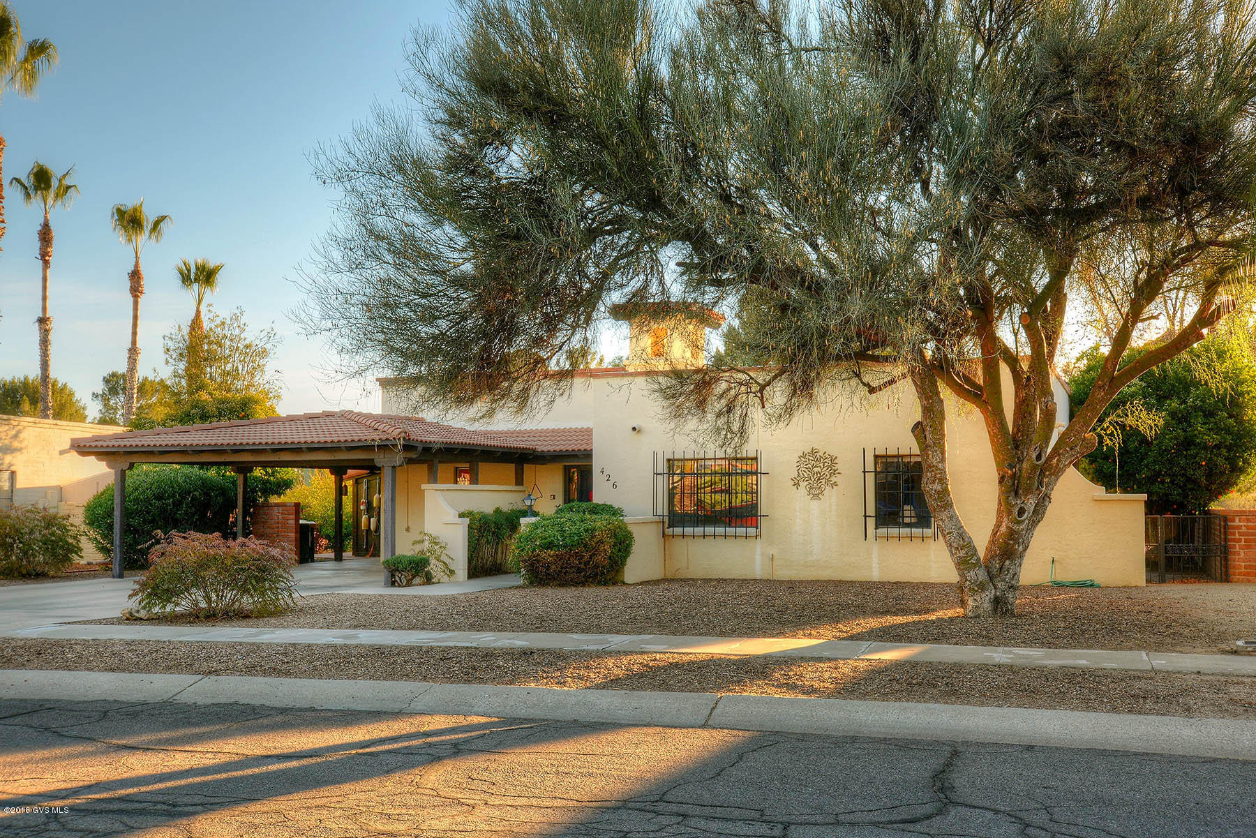 LOCATION,LOCATION,LOCATION! Enjoy a sunrise breakfast in your large Arizona room; watch the sunset light up the Santa Rita Mountains with this perfect VIEW from your back patio. Located on the 14th fairway of the Haven Golf Course,there are no other homes in your back garden to block this lovely view. Remodeled, freshly painted & upgraded, this light-filled home has 3 Bedrooms and 2 Baths with an open floor plan. The Bee-hive wood or gas burning fireplace in the Great Room includes a hand crafted mesquite wood mantle. New porcelain tile flooring throughout home, with new carpeting in bedrooms. Large kitchen has been remodeled and updated with maple cabinets and gas range. With a new HVAC unit and mature landscaping including citrus trees. this gorgeous view property is a must have!