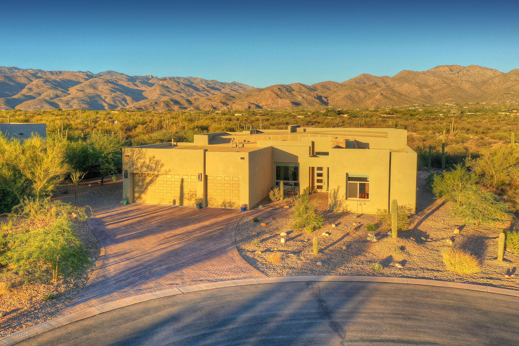 Fantastic custom built in 2019 contemporary Fairfield home on  1.3 acre in gated Rancho Saldados located in Tanque Verde Valley. Unsurpassed Catalina & Rincon Mountain views enjoyed from every room of the 3 bed/4 bath home. 20' sliding door completely opens back of home for true indoor/outdoor living. High end finishes throughout w/modern lighting & wood grain ceramic flooring, stone fireplace in the great room & show stopping powder room. Open concept & split floor plan w/ 3 bedrooms all w/ en-suite baths. Elegant kitchen w/ massive granite island, custom back splash & 5 burner gas range. Luxurious spacious master suite w/dual vanities, soaking tub & spa-like shower. Incredible attention to detail. Backyard boasts extended patio, fireplace, desert landscaping & views. Large 3 car garage.