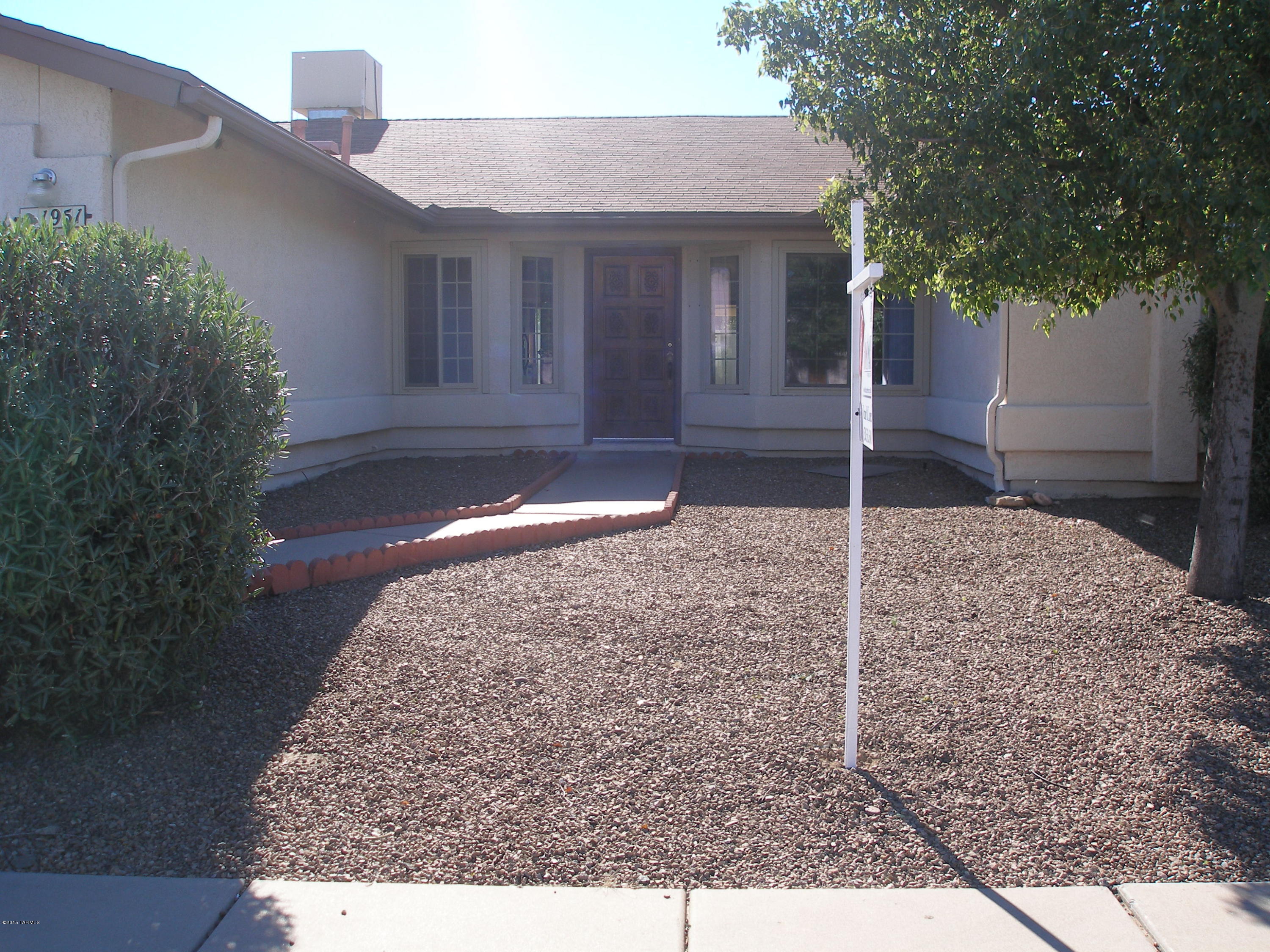 Situated in quiet cul-de-sac. Very popular floor plan with over 2100 sq ft and split floor plan. Very spacious family room with cozy fireplace. Huge master suite with large bath and lots of closet space. Ceramic and Saltillo through out home. You'll love the huge yard with two large entrances, but most of all you will love to entertain on those hot Summer days with your own gorgeous Pebble-Tech pool. Close Southwest location near I-19,shopping, and entertainment. Priced well.