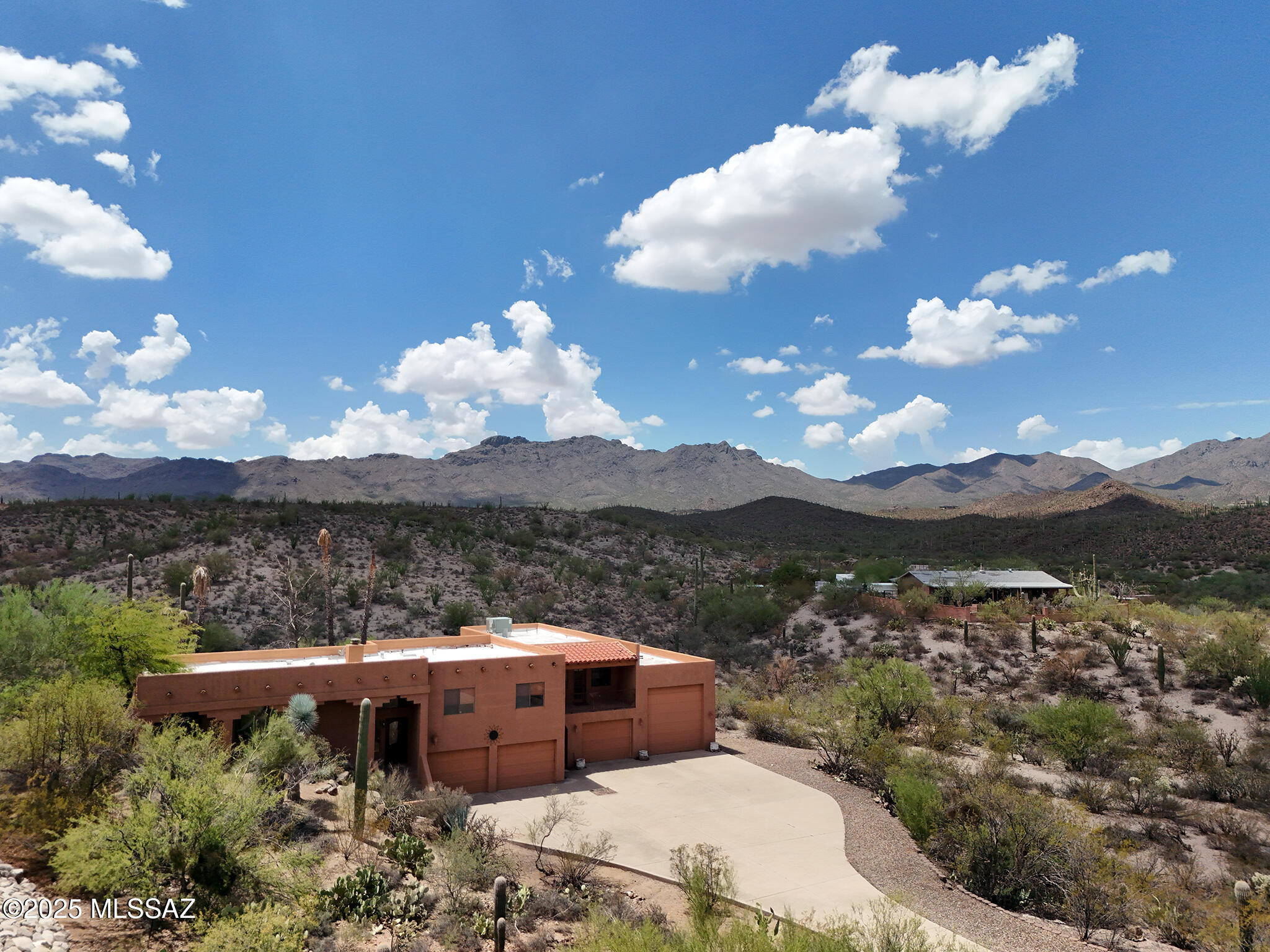 A rare opportunity awaits to own a home of this size and price in the  highly sought after Rancho Del Cerro neighborhood , offering stunning city, mountain, and desert views. This spacious 5 bedroom home sits on over 2 acres and backs to open desert, with direct access to nearby hiking trails from the  backyard.
The expansive downstairs game room includes a pool table, wet bar, refrigerator, 
& a hidden storage room.  A separate guest bedroom & 3/4 bath are also located on this  level. 
The  large primary suite features his & hers walk-in closets & a private balcony-perfect for enjoying distant city lights.
Car enthusiasts & RV owners will appreciate the RV garage which has over 25ft. of built-in cabinets, 30 amp electrical ,and an RV drain hookup just out the door.