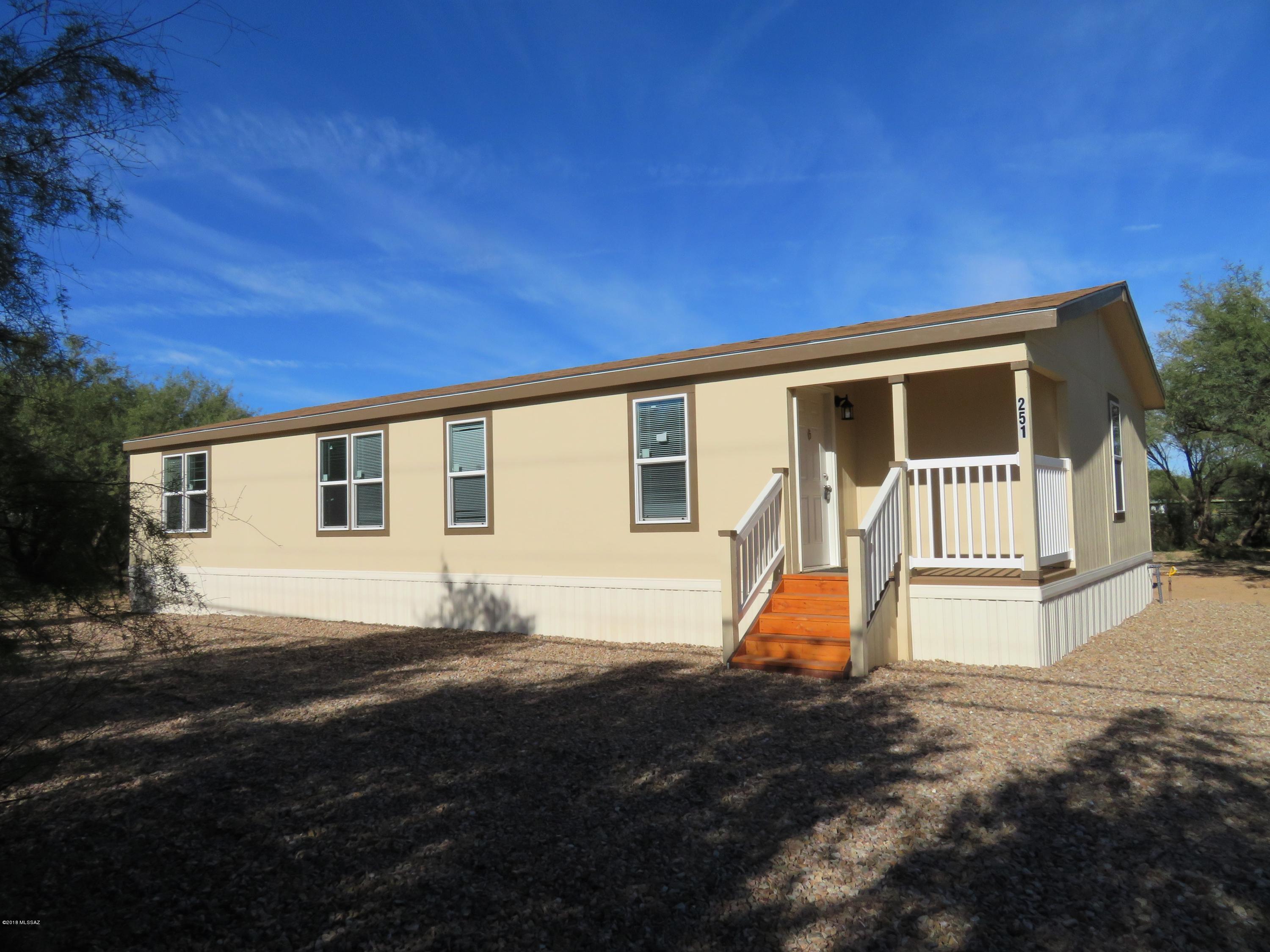 Affordable brand New 2018 Fleetwood Manufactured home on 2 Acres of Horse property. fenced arena and covered horse stalls! 3 bedroom 2 full bath home, with light and bright colors. Beautiful kitchen with gas range, built in Microwave, dishwasher and refrigerator, Breakfast bar and huge walk in Pantry, split floor plan with Large Master bedroom with attached bath, Walk in closet, Generous sized 2nd bath, Covered Entry porch, Central AC with gas furnace.  This wonderful home is located off a paved street is a easy commute to Benson or Tucson, Why buy used when you can purchase a new home that is complety set up! Come visit today.