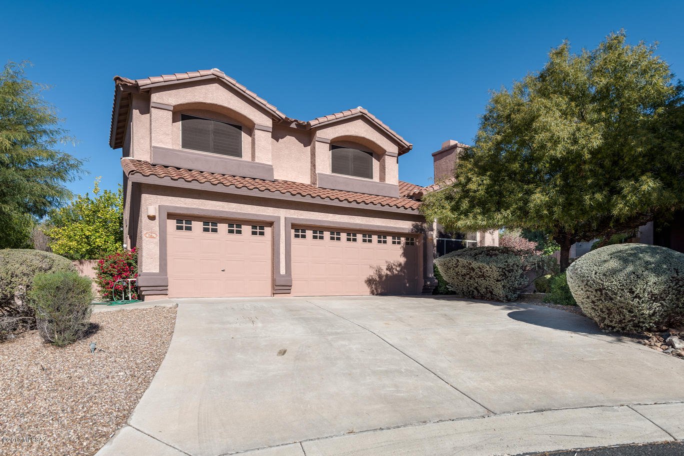 A truly elegant foothills home located in a convenient gated community on an oversized lot. This home captures the outdoor living spaces that Tucson enjoys. Artistically chosen with mature landscaping pebble tech pool, built in BBQ, fountains and stunning views of the mountains, the interior with spacious master bedroom, bath with spa tub, sitting room and exterior balcony with mountain views, additional 3 bedrooms with bath on second floor, and a very private guest quarters on main floor. Whether you are entertaining and dining casually or with a formal flair, your family and friends will feel welcome. If that wasn't enough, this home has its very own elevator for easy access to the 2nd floor.