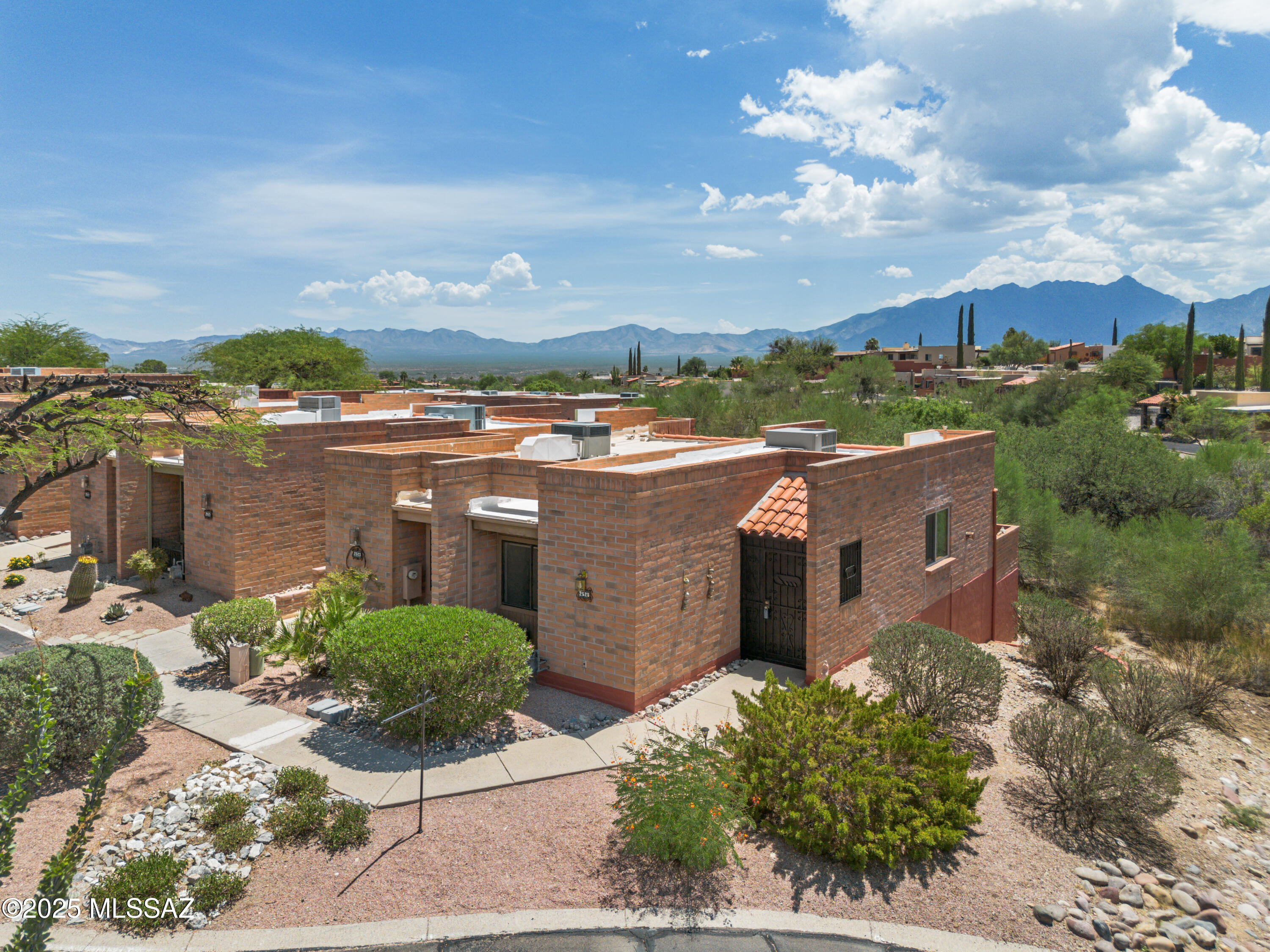 Looking for a great retreat with personality and charm?  This one-bedroom, one-bath townhouse is the one!  As a private elevated end unit, it gives you a bit more light, a touch more quiet.  With its lovely patio to soak in the desert views. 

The standout feature has to be the open floor plan and the gorgeous Bee Hive gas fireplace, in the living room.

The galley kitchen is practical and well-equipped with a pass-through window, a skylight for natural light, and plenty of counter space for prepping your next meal or simply unloading groceries. 

The low-maintenance tile floors in the living area keep the living area cool and easy to clean, while the bedroom offers soft carpet for comfort.

The bathroom has been updated with a new shower door and has a nice granite countertop. Step outside to your covered patio with built-in garden planter and enjoy some fresh air along with a great view of the Santa Rita Mountains.  

There is also a stack washer and dryer tucked away in the storage room for ultimate convenience.

You will also appreciate the wrought iron security door, for those a  nice breeze to flow through.  Then just steps away from your unit right on the end you will have covered parking with a spot just for your unit.  You will also have access to all the great amenities of Green Valley Recreation.  

Come and take a look at this great cozy property that is neat and tidy and is move in ready for you to start making memories in.