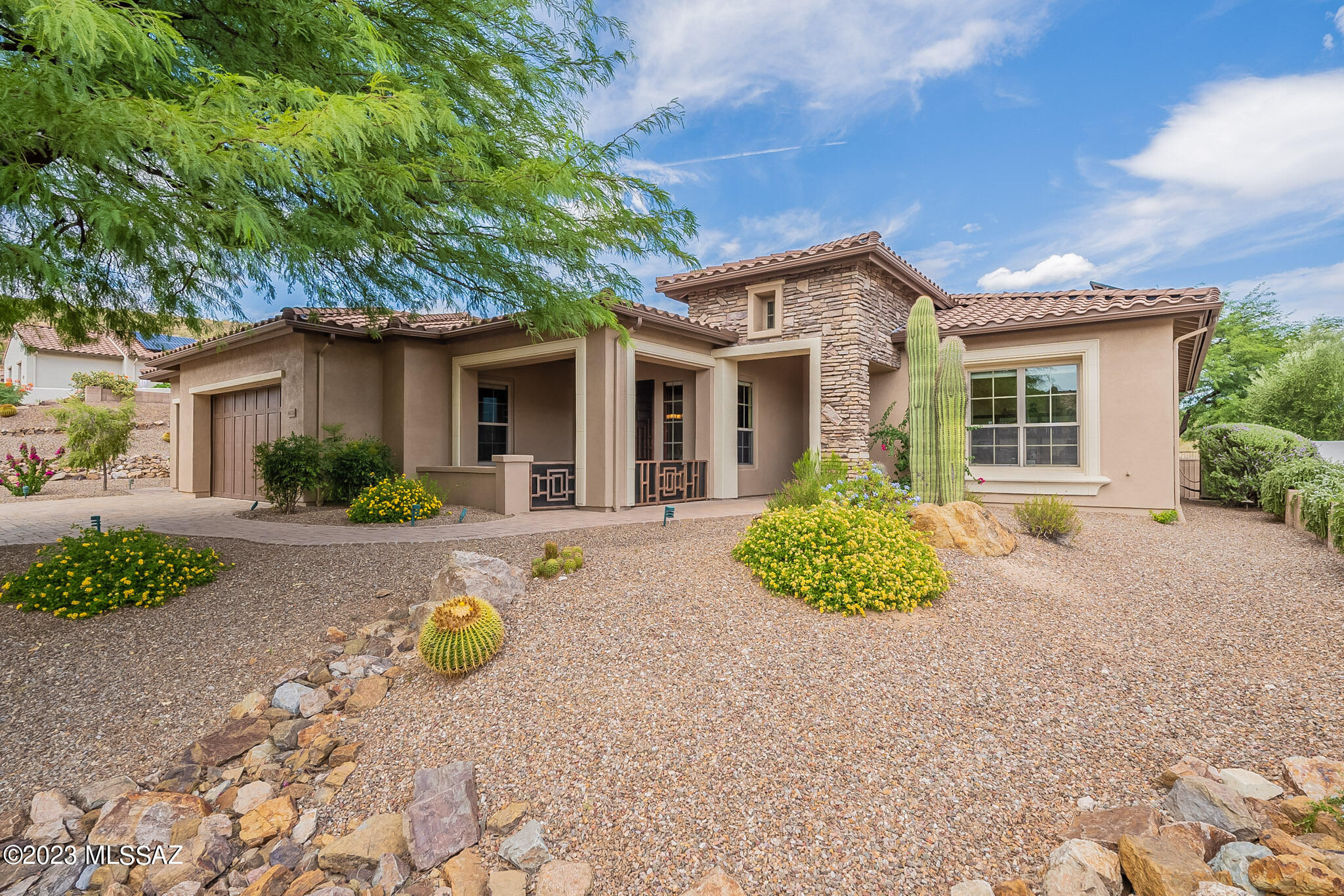 Price Reduced, Sabino Model in the Preserve. Beautiful backyard with owned solar and water softener. 2 bedrooms, 2 full bathrooms, a lovely 1/2 bath, and den. The large owner's suite has a patio door, walk-in shower, tub, and walk-in closet, as well as a powder room. The guest bedroom has a patio door, bathroom, and walk-in closet. The spacious kitchen has an eating area, and a front patio off the kitchen with double doors, walk-in pantry, and SST appliances. Laundry room has W/D, Great room features a custom gas fireplace and large windows, The backyard has a large pergola-covered patio, a built-in BBQ, and a fire pit with natural gas, while the front-covered patio offers stunning views. New paint in and out. Extended 3 Car Garage with epoxy floors, cabinets and 2018 water heater.
