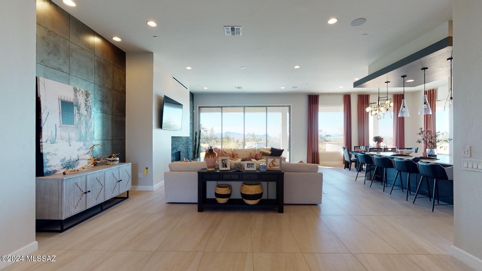This very popular Manzanita home sits on the perfect corner lot in a cul-de-sac at the base of the Tortolita Mountains! You won't want to miss out on this one! Featuring 4 en suite bedrooms, a flex space, an office, 12' ceilings, and an large 16'X10' multi panel slide that opens to your covered patio and secluded backyard. The contemporary exterior and grand pivot door create an incredible entrance to this home.  Renderings are conceptional and may not depict the exact final product.