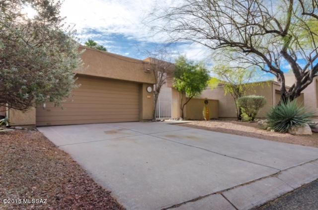 With new paint and new carpet this 3 bedroom home located in Bosque Creek awaits your finishing touches. This spacious two story model features 2 bedrooms with a split bath and a large loft upstairs.  Downstairs provides an open living room with 16 ft. vaulted ceilings, fireplace and french doors to access the back patio. For convenience the master suite is on the first floor. Situated in the heart of the Fort Lowell Historic District this neighborhood provides a peaceful, quiet oasis with mature vegetation, deciduous and native trees. 
 A secluded community pool is accessed through a Mesquite grove with a shady picnic area.  From there it is a short walk to the Rilito River Park. This home is conveniently located near the Tucson Medical Center, shopping and casual dining.