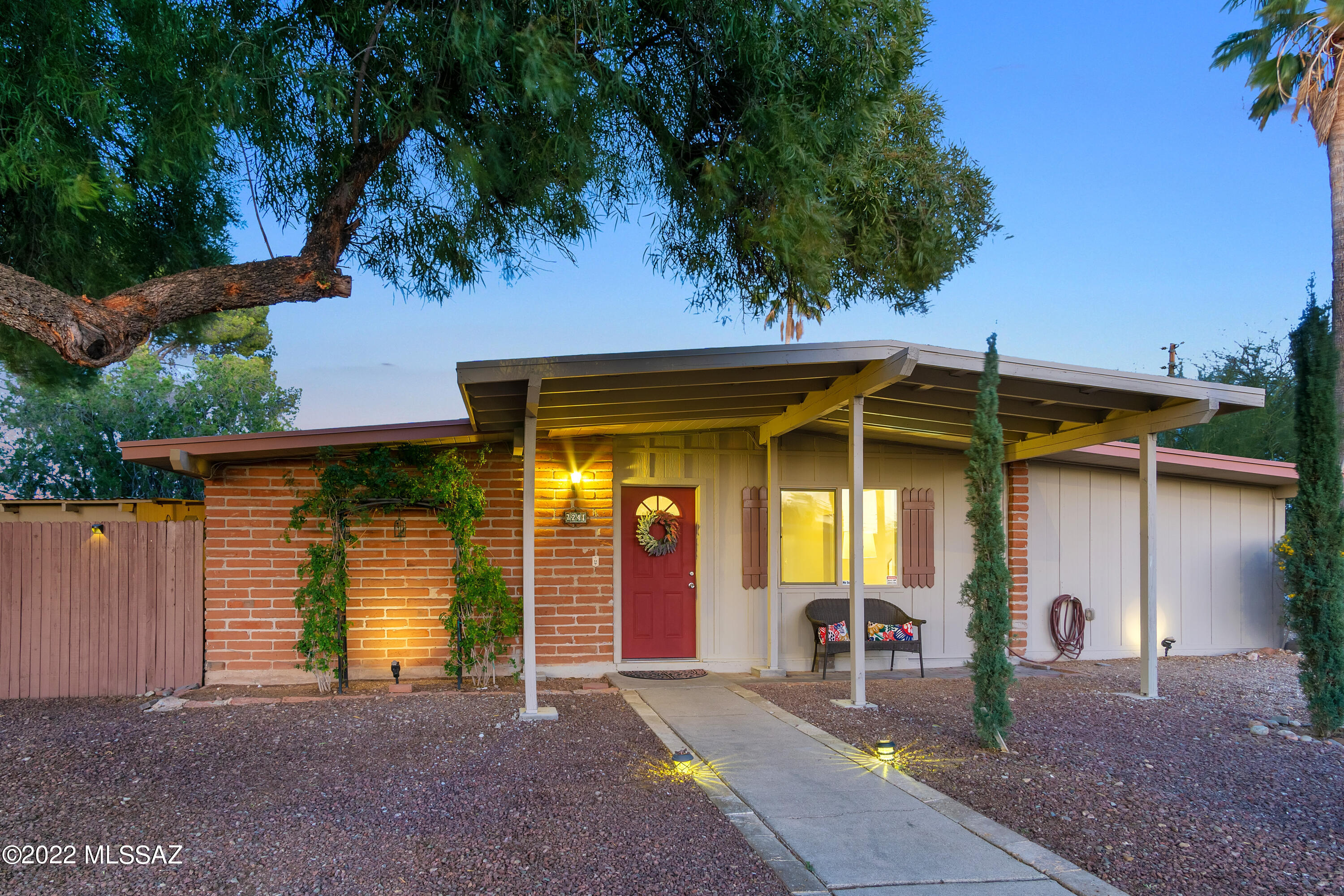 You will love this Mid-Century Charmer for years to come! Backing to mega open space yet within minutes to schools, shopping, medical and The Loop! NO HOA!! Bring your toys:) What a sweet, inviting 5 Bedroom home this is. A spacious Kitchen accommodates a flurry of activity as it opens to Dining & French Doors that lead to the large Cov'd Patio. Built-in charcoal grill is nearby.  NO CARPET anywhere & the Roof was just Recoated. Entirely freshly painted throughout. New dual pane windows in all bedrooms.  The large 5th Bedroom has it's own mini-split heat/cool system.  On nearly 1/4 acre, outdoor time here will create memories for a lifetime.  Plenty of party space, a private ramada, solid wood playhouse, firepit and diving pool fenced for safety.  Mountain VIEWS add perfection to this GEM
