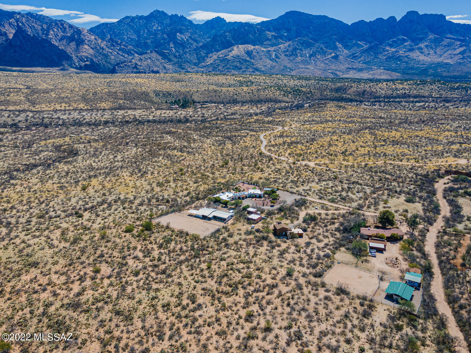 Private and Serene living close to 1.7 million acre National Forest. Gorgeous burnt adobe brick residence complete with granite countertops and stainless appliances.  Soaring vaulted ceilings throughout.  Dual fireplace in Great Room and Master Bedroom. Living area off kitchen Custom Brass and Copper vessel sinks.  Three bedrooms plus bonus Room and Loft.  Spacious covered patio overlooks pool/spa and Mountain views.  Custom Horse facilities.  4 Stalls and lighted riding Arena and round pen.  Separate building Tack and  Hay storage.  Covered RV or Trailer storage. Over height garage door on North bay. Net Metered Solar.  Two zoned water heaters plus instant Hot Water heater in Kitchen. Drip watering system in both front and back yards. MUST SEE! New Roof Under Contract.