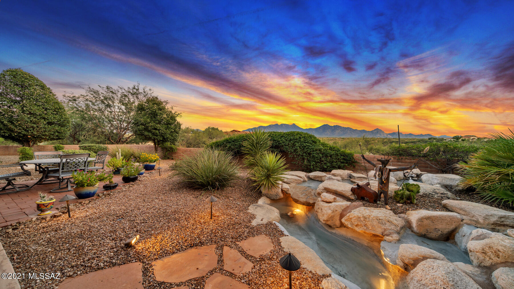 Experience timeless beauty with a backyard kissed with misters, a built in BBQ, & trickling sounds from the waterfall. It's perfect for two while overlooking the dramatic valleys & iconic Santa Rita Mountains. The surrounding hills are ripe with outdoor adventure. You'll be amazed with all the high end finishing touches on this gorgeous custom built home. The delightful & spacious 3 car garage has a workshop plus a relaxing Sauna included! Benefit from 2 new top of the line HVAC units w/ programmable smart thermostats, NEW Speed Queen W/D, & advanced termite baiting system. It has speakers throughout the whole house. Windows are highly upgraded with wood casing. An RV clean out with a concrete pad is on the NW side. Exterior recently painted. Please see list of improvements in Documents.
