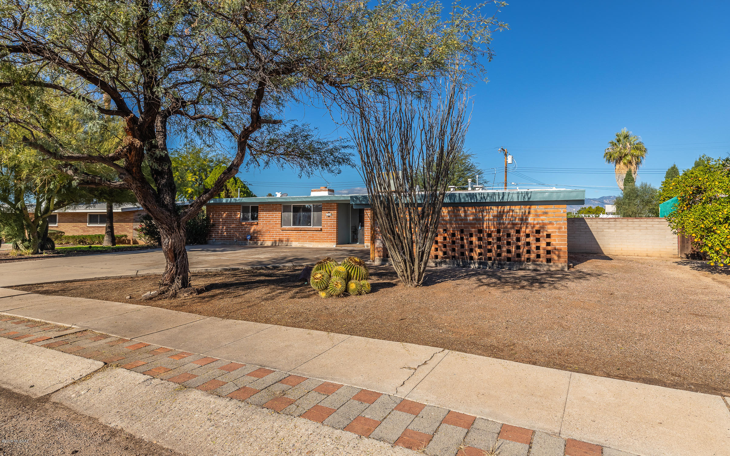 UNDER $205k with a POOL!!   This 3 bedroom/ 2 bath home is going to check ALL of your boxes! It has a large front yard for plenty of on-property-parking, including a double carport, mature vegetation, & NO HOA! Many of the windows & sliding doors have been upgraded to DUAL PANE, the kitchen boasts beautiful cabinetry & granite counters, the floors are ceramic & BRAND NEW CARPETING!  The interior doors, handles, & vent covers have been replaced, fresh paint throughout, large, open floor plan w/ HUGE living room, family room, dining, breakfast nook, and breakfast bar seating!  Kitchen has black & stainless appliances w/ pantry closet.  There's a huge INDOOR laundry room w/ plenty of storage!  The lot is a fifth of an acre & the yard has a block wall for privacy.  Schedule a viewing TODAY!!
