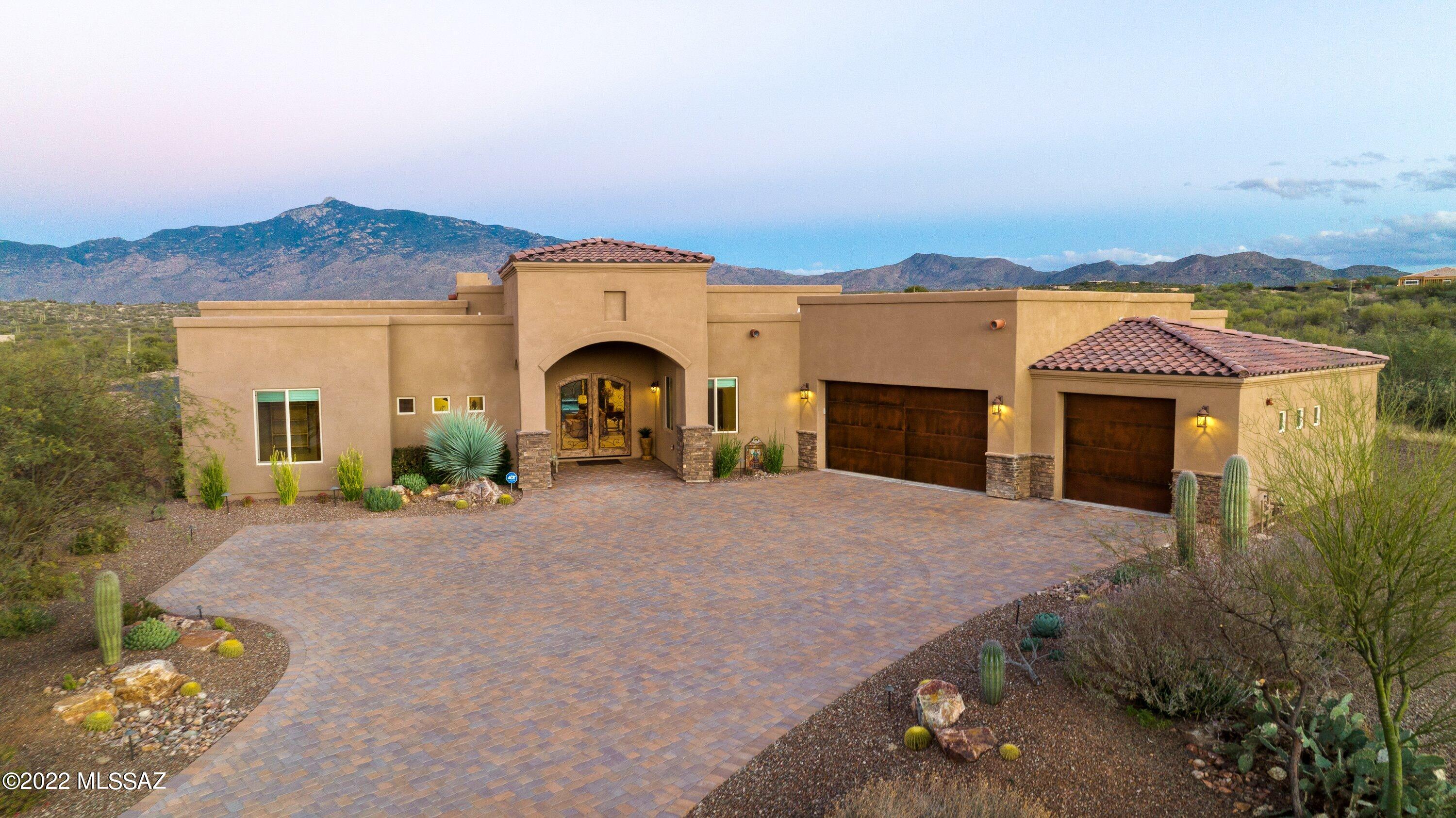 Luxury living at its finest in Coyote Creek a master planned community situated on the out skirts of Tucson.
Built in 2018 true  Pride of ownership! Upgrades galore. Planked ceramic flooring through-out. Breathtaking views, Great room w/stack stone fire place, chef style kitchen (stainless appliances convey), dining room  area off kitchen, 3,337 sf., 4bd, 3-1/2ba, office/den. Backyard is complete with resort style heated pool and spa, brick pavers and a 3 hole putting green. Oversized
garage with hanging storage. Close proximity to Tucson International Airport, 25 minutes from major employers.  Miles and miles of dedicated trails, state of the art equestrian center 2-16 stall barns, 4 showers, 2 feed rooms, 2 round pens, 1 arena and recreation center tennis, pickleball, basketball and children's playground.