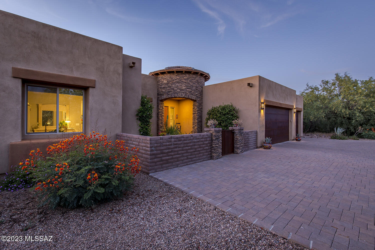 Wake up to the songs of the desert and panoramic views of the Catalinas. Beyond the charming courtyard entry you will find serenity andprivacy and a connection to the natural beauty of the landscape. Nestled in a small gated community of six homes in the foothills of the Catalinas in the Tanque Verde school district. Spacious and open floorpan w/ 10' and 11' ceilings, a kitchen that would delight any chef w/ quartz countertops, maple cabinetry and a waterfall island...both beautiful and functional. A curved wall of windows is a beautiful architectural detail that dramatically embraces not only the Catalinas but the Rincon mountains too. This is the perfection of indoor/outdoor living. This is the perfection of indoor/outdoor living. The Sellers have added a swim spa, outdoor fire feature, a grilling center, water softener and solar (yes, it's owned). Be sure to look at Documents for more information.