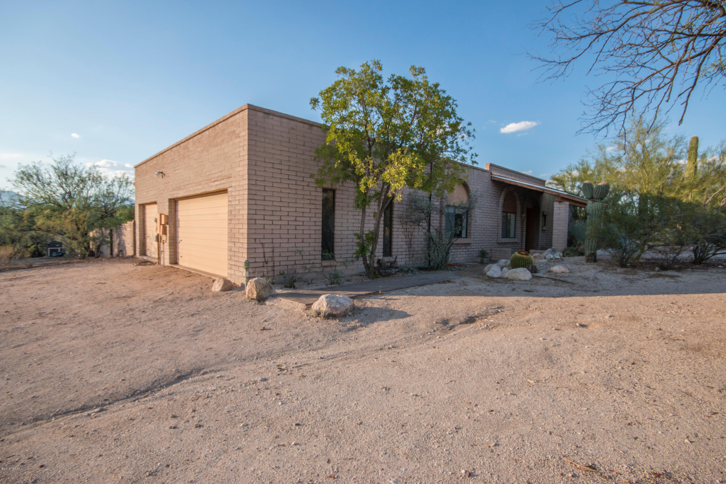 Classic burnt adobe style home on a huge 3.27 acre lot with plenty of room for toys! Workshop bay in the garage with a 1/2 bath for mechanic. Open floor plan with formal living areas, and so much more! Relax under the covered patio or in the spa and enjoy panoramic mountain views from all around the home! Don't miss this amazing opportunity to own your own private retreat away from the city!