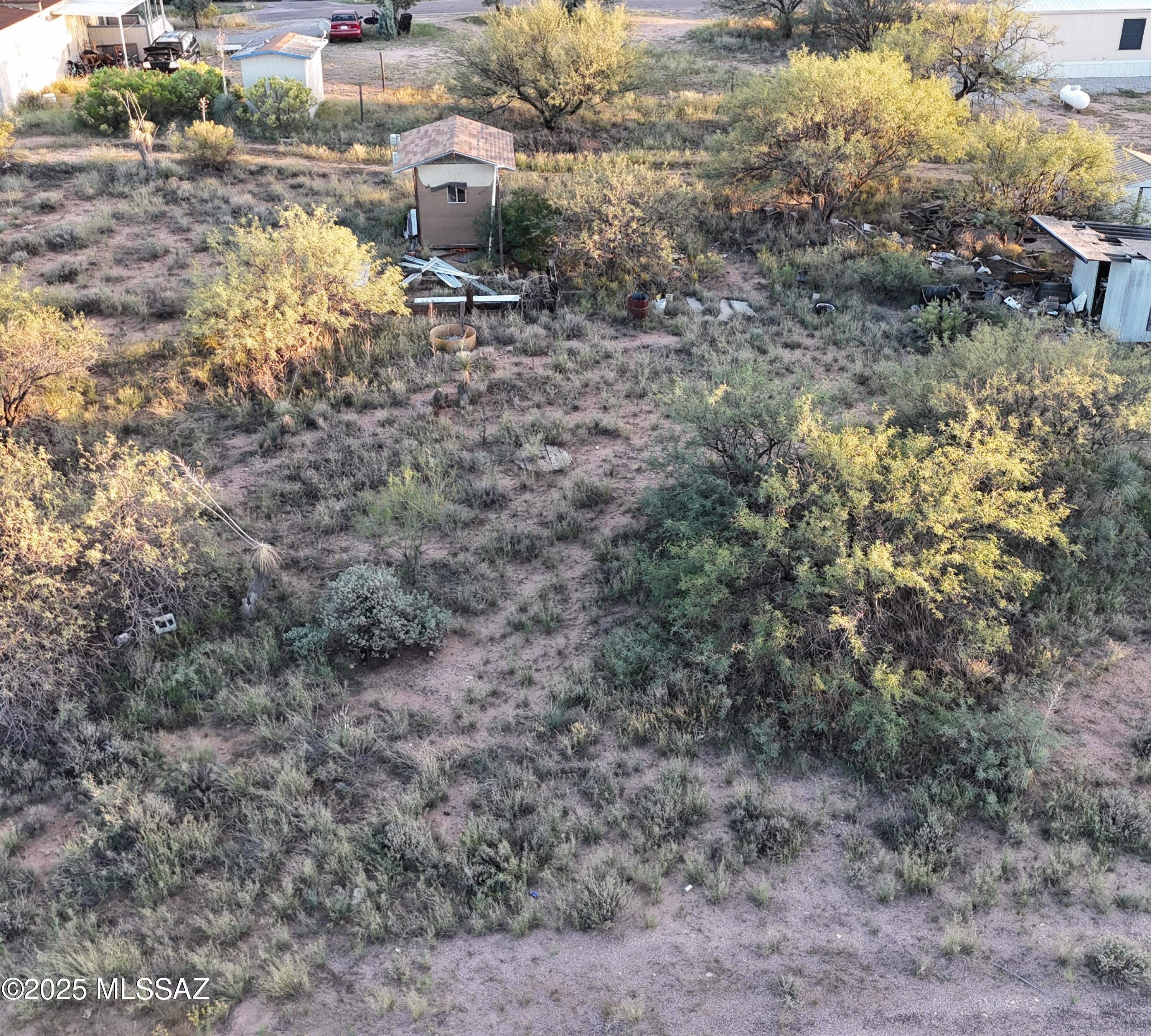 Discover the perfect canvas for your dream home or investment project with this generous 0.19 acre parcel nestled in the heart of a welcoming Benson community. Flat topography and natural desert landscaping, this land offers both beauty and buildability. Ideal for manufactured home or build your dream home. Utilities close to lot line. Buyer will need to install septic system.