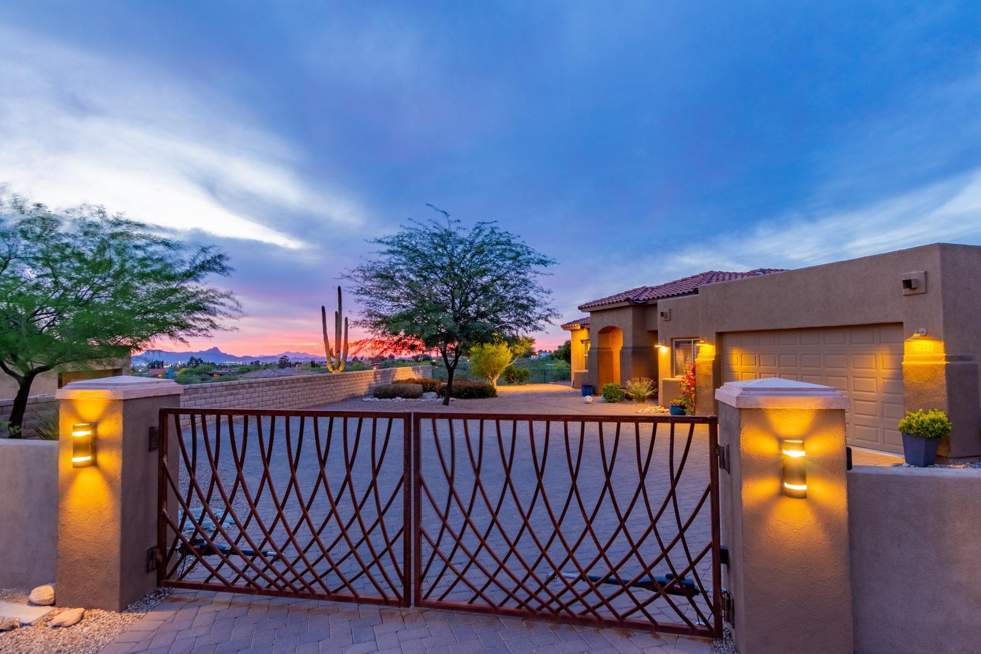 Spectacular AF Sterling home built in 2015 situated on a 1.17 acre lot with gorgeous Catalina Mountain views and twinkling city lights. You'll love the private setting with a common area to the west overlooking a pristine desert wash and securing forever privacy!! It is refreshing to see a home in pristine condition with all of latest and greatest features of a newer home. Split floor plan with private master suite on one side complete with a large walk-in California closet and a well-appointed bathroom en-suite, walk-in tiled shower. Chefs kitchen with plenty of space, granite slab countertops, island and breakfast bar overlooking kitchen nook and family room. Additional features include stainless steel appliances and custom glass tile backsplash and upgraded cabinetry. Fantastic backyard is ready for year-round enjoyment with an oversized covered patio, expansive pavers, and plenty of room for a pool. Additional upgrades include custom gated entry, west side rolling shutters, ample tile, mini split in the garage and a fantastic laundry room! Excellent location, minutes to La Encantada and restaurants.