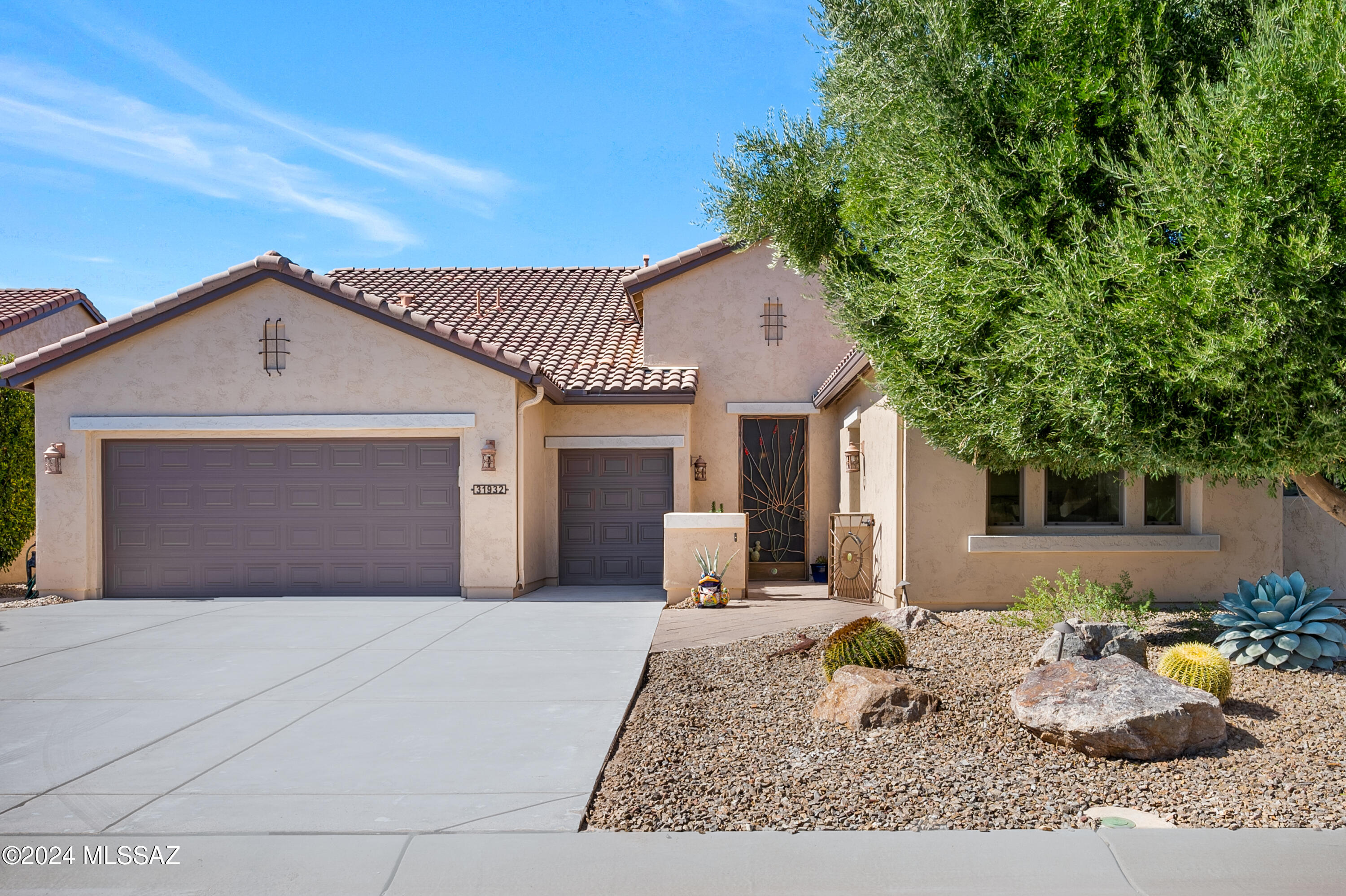 Welcome to this exquisite Pima model home nestled in the award-winning Saddlebrooke Ranch,  a premier retirement community.  This immaculately maintained property boasts a luxurious separate guest casita with a spacious walk-in closet and a fully upgraded ensuite bathroomperfect for hosting visitors in style.  Step outside and immerse yourself in the resort-like backyard,  featuring a luxury heated pool,  complete with travertine hardscape and a covered patio. The pool is heated by both gas and solar,  with fully paid-off solar panels ensuring energy efficiency and cost savings.  Entertain outdoors with ease using the built-in gas grill and relax by the custom gas fireplace,  recently upgraded with new insert components.  The covered patio has new outdoor ceiling fans for year-round comfort, and a raised herb garden adds a delightful touch of nature. The curb appeal of this home is undeniable, with a freshly repainted exterior, a newly resurfaced driveway, and recently installed rain gutters. The welcoming front courtyard, complete with a wrought iron gate, provides security and a stylish entrance. Inside, the kitchen is a chef's dream, featuring energy-efficient appliances, a large island, and granite countertops. Generous cabinet space with pull-out shelving and a reverse osmosis system at the sink ensure both convenience and sustainability. The great room is a showstopper with custom wood built-in cabinets, a surround sound stereo system, and an elegant TV console for your entertainment needs. The primary bedroom is bathed in natural light and showcases premium luxury laminate flooring, while the laundry room offers extensive storage and a utility sink. The garage has been extended by four feet and includes overhead storage, wall cabinets, a bike pulley system, custom epoxy flooring, and a well-serviced water softener. This home also features a dedicated office space with built-in shelving and cabinetsideal for a workspace, study, or library. The standout feature of this property is that every bedroom has an ensuite bathroom, providing ultimate comfort and privacy. Living in Saddlebrooke Ranch means enjoying world-class amenities such as golf, pickleball, swimming, and even a local brewery. Make this desert oasis your home and experience the finest in retirement living. Schedule your showing today!