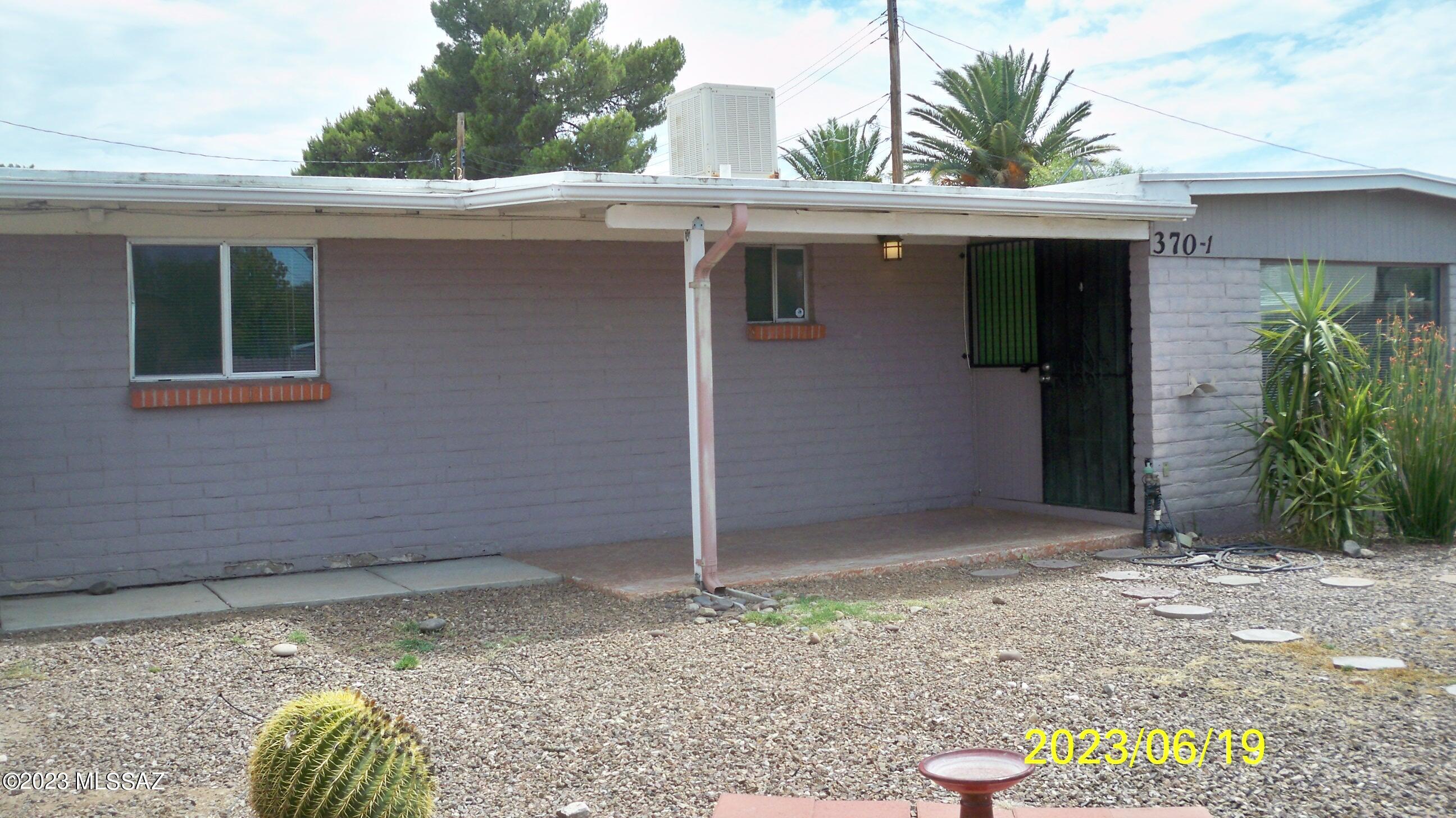 ***THIS UNIT IS VACANT AND AVAILABLE FOR IMMEDIATE OCCUPANCY UPON AN APPROVED APPLICATION!   Highly desirable location offering all the amenities of a single family home!  This unit features a huge living room and dining area, spacious kitchen with abundant kitchen cabinets and countertops, three bedrooms, two baths, rear laundry room with washer/dryer included, a carport plus a parking space!   All this plus a large private front yard area and Catalina Mountain views!
