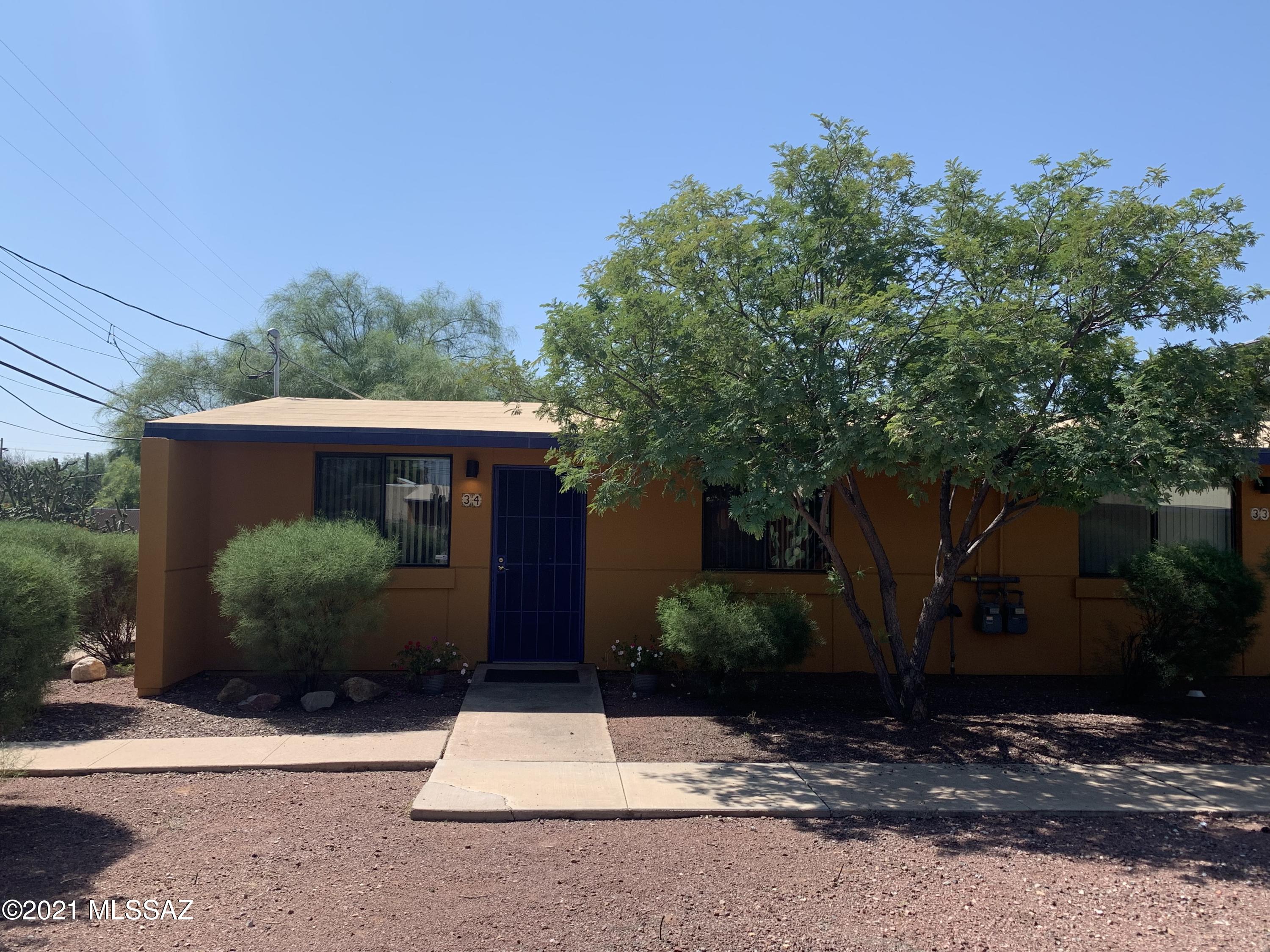 Premium single story bungalow one bedroom condo near downtown.  Corner unit with wood and tile floors, security door, finished back yard with pavers.  Gated Community with pool, spa, basketball court, Ramada, grills, and playgrounds.  Close to shopping, U of A, A Mountain, bus lines, hospital, and I-10.  Includes Washer and Dryer.