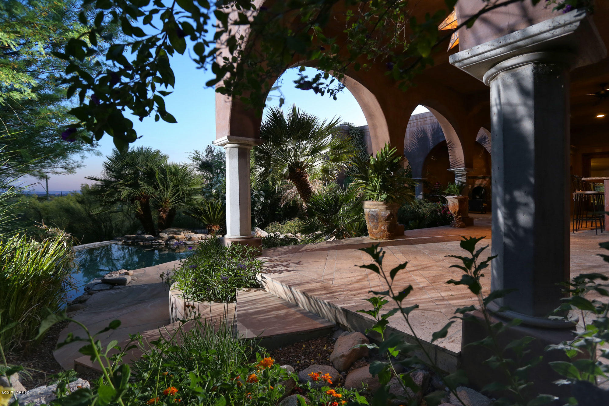 Imagine driving up to your own private, gated foothills estate captivated by the lush & professional landscaping where every step takes you deeper into your own personal oasis.  This Quality Howard Curtain masonry built home is exemplified by the exquisite tasteful updating throughout w/ restoration hardware, light fixtures, mirrors & vanities, new Quartzite countertops in kitchen & baths. Relax pool side with breathtaking city & mountain views enhanced with soft landscape lighting creating the right measure of ambiance.  This 4 bd 5 ba, 4,512 sq ft home offers privacy for visiting guest w/ private guest casita.  Entertaining is a breeze w/ outdoor kitchen including: granite countertop, wet bar/grill with sink, negative edge pool & hot tub, outdoor fireplace and large deep covered patio