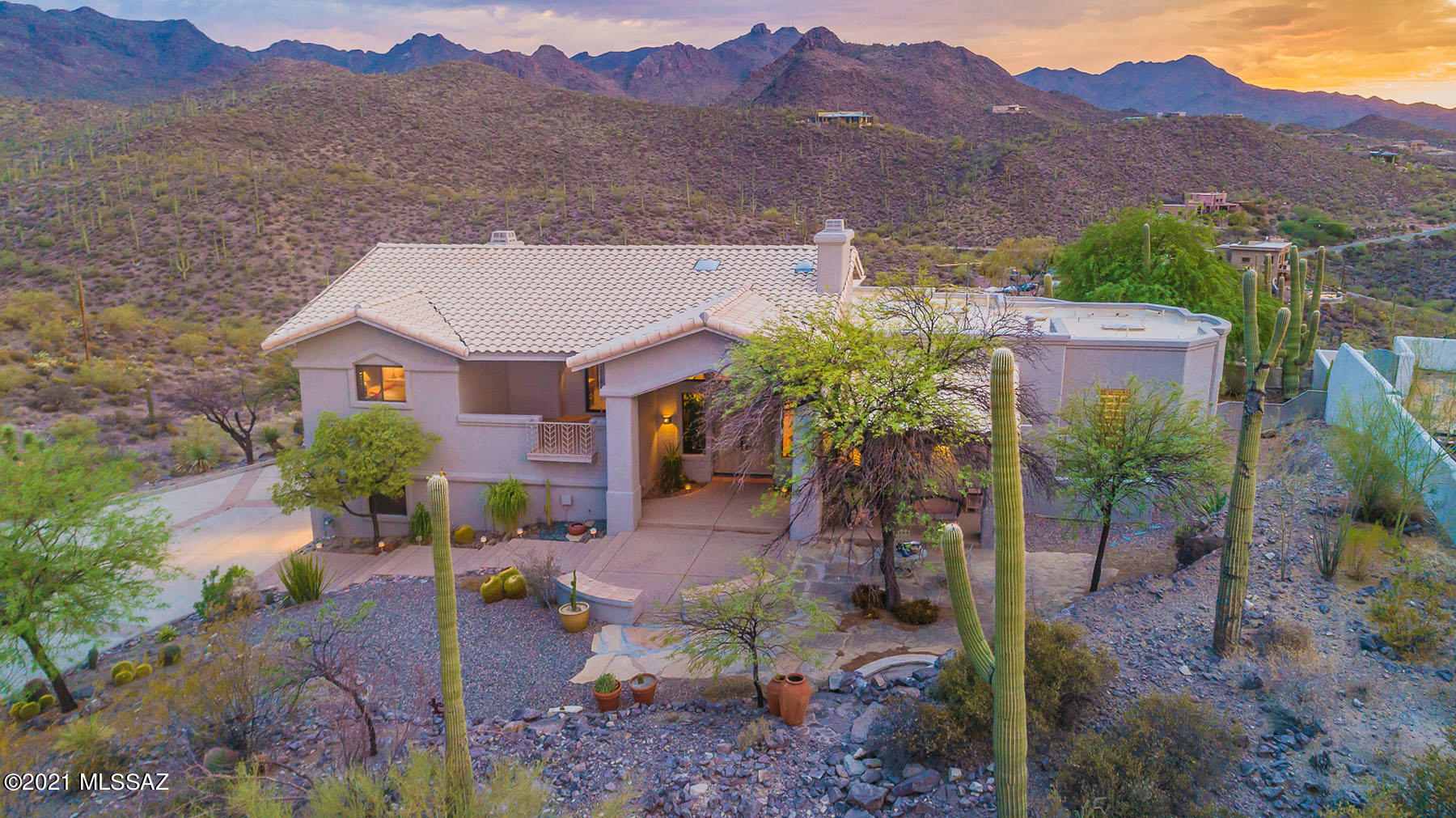 Estate Sale. Amazing custom home perched on a 2.3 acre hilltop lot offering STUNNING views of the mountains, city lights, sunsets & sunrises. This 3BR w/den custom home features soaring  wood beamed ceilings and super Saltillo tile floors. Gourmet island kitchen w/KitchenAid appliances, built-in refrigerator and custom cabinetry. Luxurious master bathroom with granite tiled countertops, dual vanities and jetted tub. Spacious great room with cozy fireplace. Resort style outdoor living w/sparkling pool, 3 covered patios,  built-in BBQ and STUNNING views! Brand new 14 Seer HVAC system! Roof serviced by Hallmark Roofing. Circular concrete driveway. EZ access to I-10, downtown & Sweetwater Preserve. See floor plan, 3D scan and video. See agent only remarks for estate sale offer requirements.