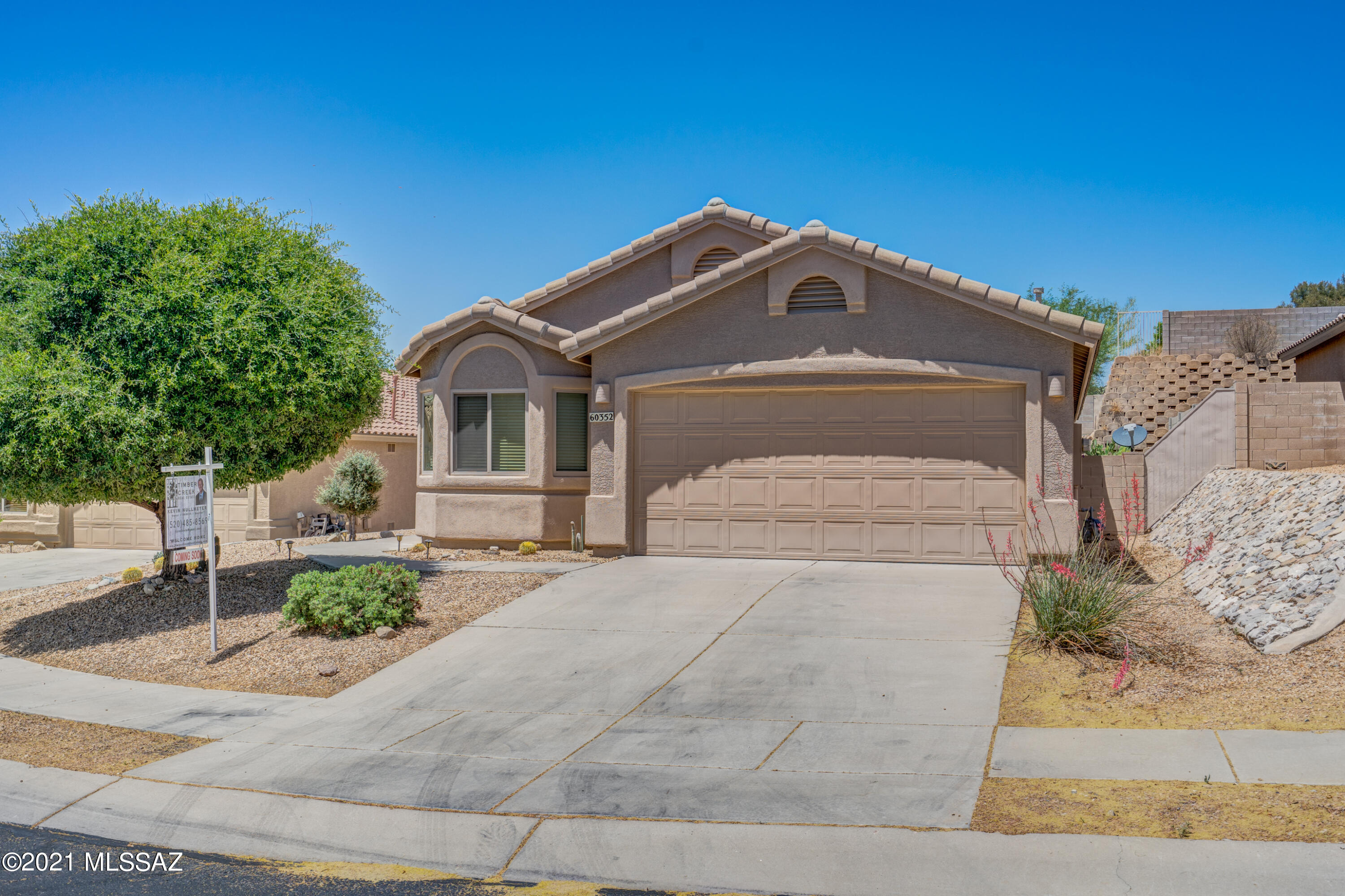 A very popular & open 1560sqft are offered in this Pecos II floor-plan w/ 3/2 + home-office in Eagle Crest Ranch. The entry opens to a generous central great room w/ vaulted ceilings & cozy fireplace. An open, sizable kitchen just adjacent to the dining nook features a functional island, maple cabinets, tasteful backsplash & loads of natural light from a new solar tube. A split-plan maintains the master to the rear & 2 guest beds w/ the hall bath smartly centered. An optional 4th bedroom can be utilized as a home office, family room extension, or a playroom for the little ones. Fig, pomegranate, & citrus trees populate the tastefully landscaped & terraced private rear yard (all on automatic drip). Owners are seasonal visitors so all systems & appliances have seen much less use than most.